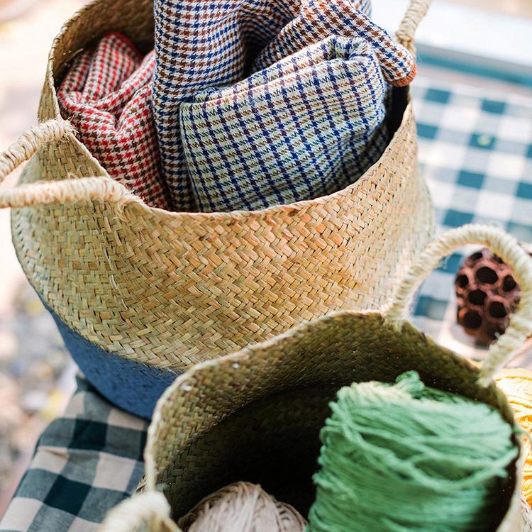 A stylish Straw Basket Pop Up Belly Basket in natural straw with colorful options, showcasing its unique pop-up design and various sizes.