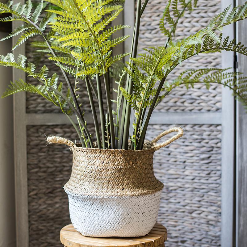 A stylish Straw Basket Pop Up Belly Basket in natural straw with colorful options, showcasing its unique pop-up design and various sizes.