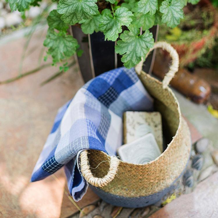 A stylish Straw Basket Pop Up Belly Basket in natural straw with colorful options, showcasing its unique pop-up design and various sizes.