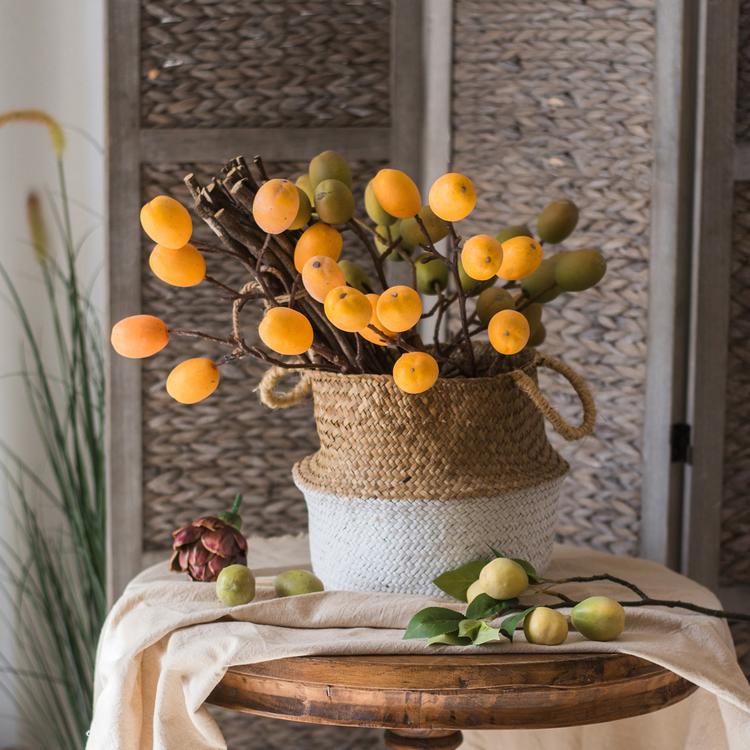 A stylish Straw Basket Pop Up Belly Basket in natural straw with colorful options, showcasing its unique pop-up design and various sizes.