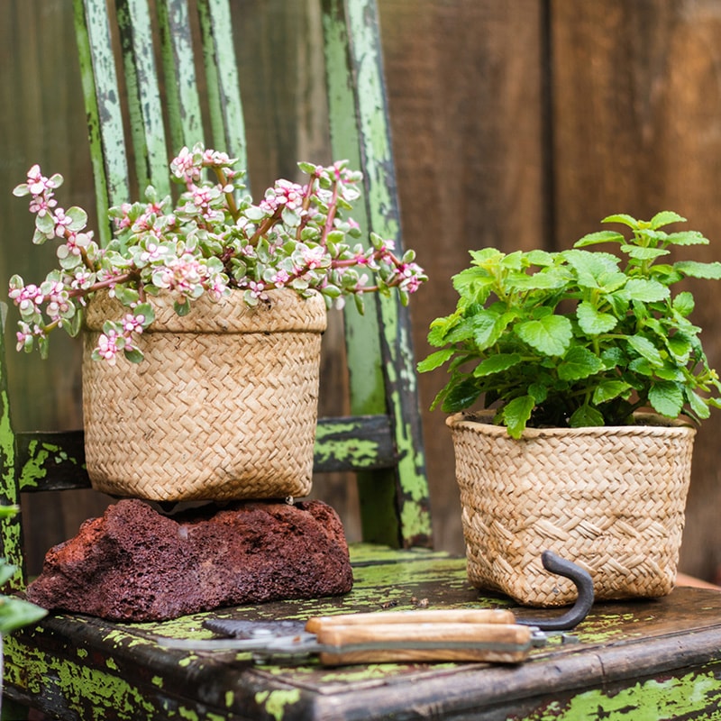 Straw Basket Style Concrete Planter in khaki color, showcasing its elegant design and drainage hole.