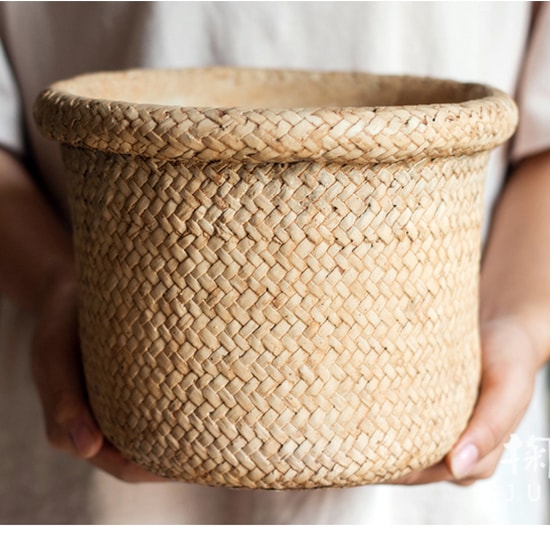 Straw Basket Style Concrete Planter in khaki color, showcasing its elegant design and drainage hole.