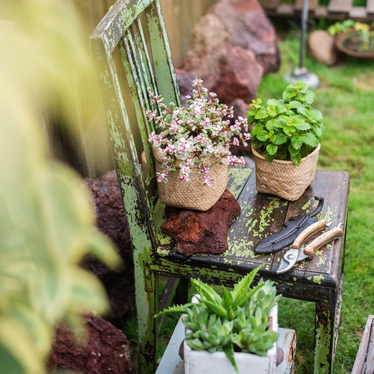 Straw Basket Style Concrete Planter in khaki color, showcasing its elegant design and drainage hole.