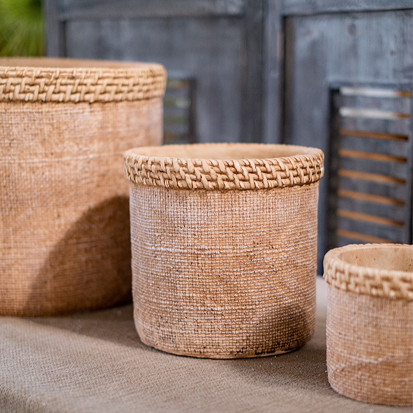 Straw Looking Concrete Planter in khaki color, showcasing its unique straw-like texture and drainage hole.