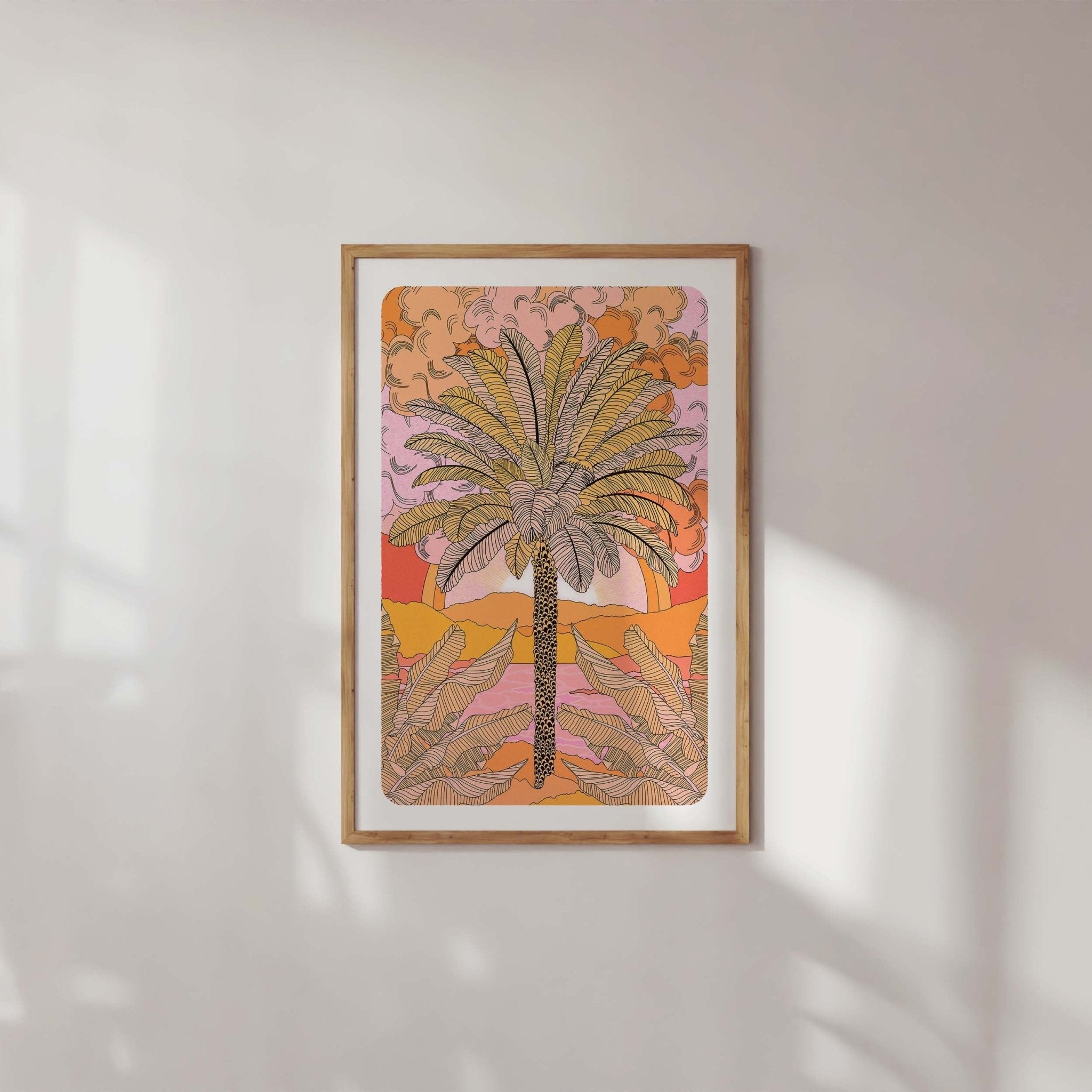 Sunset Palm Art Print featuring a palm tree illustration with mountains and a warm orange sunset gradient.