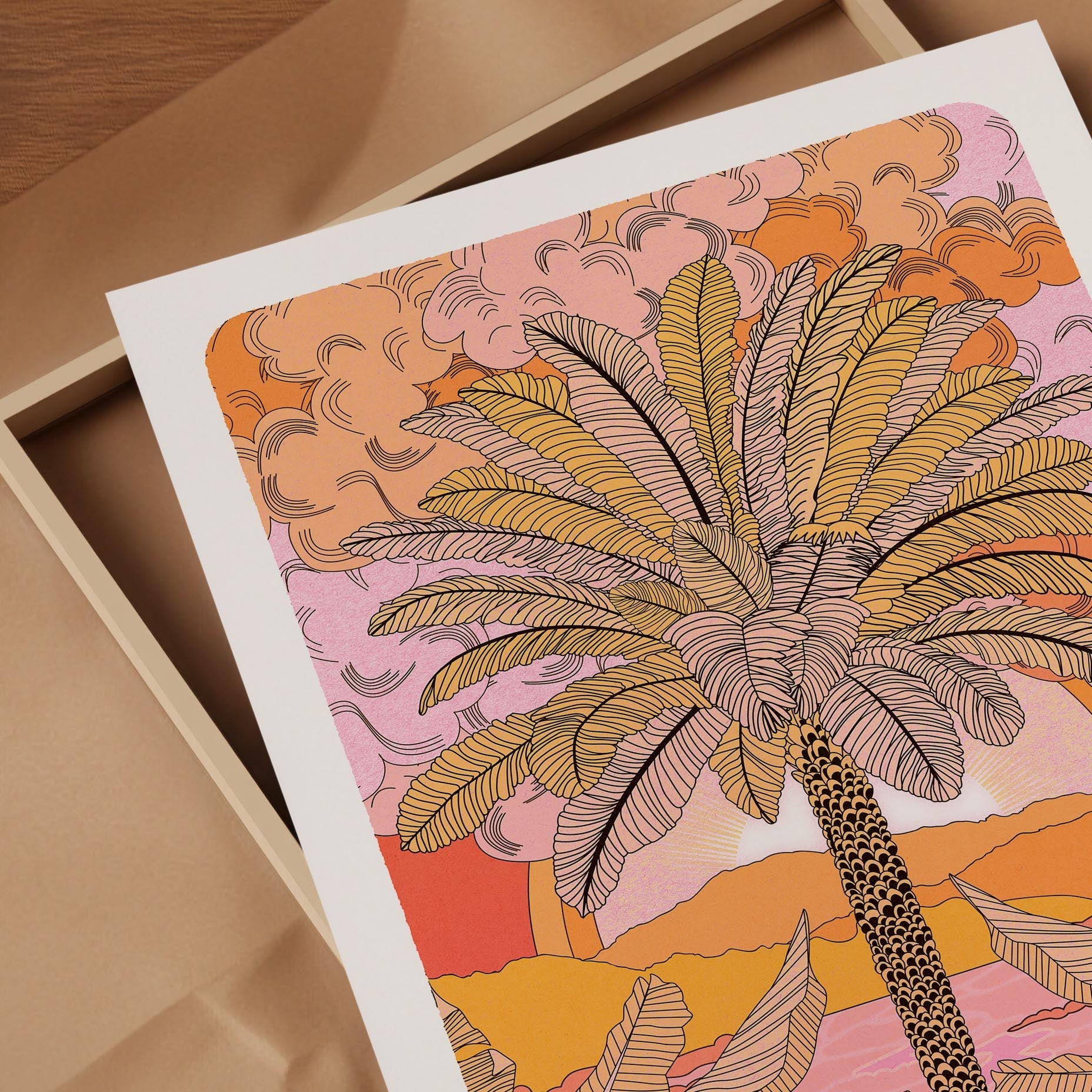 Sunset Palm Art Print featuring a palm tree illustration with mountains and a warm orange sunset gradient.