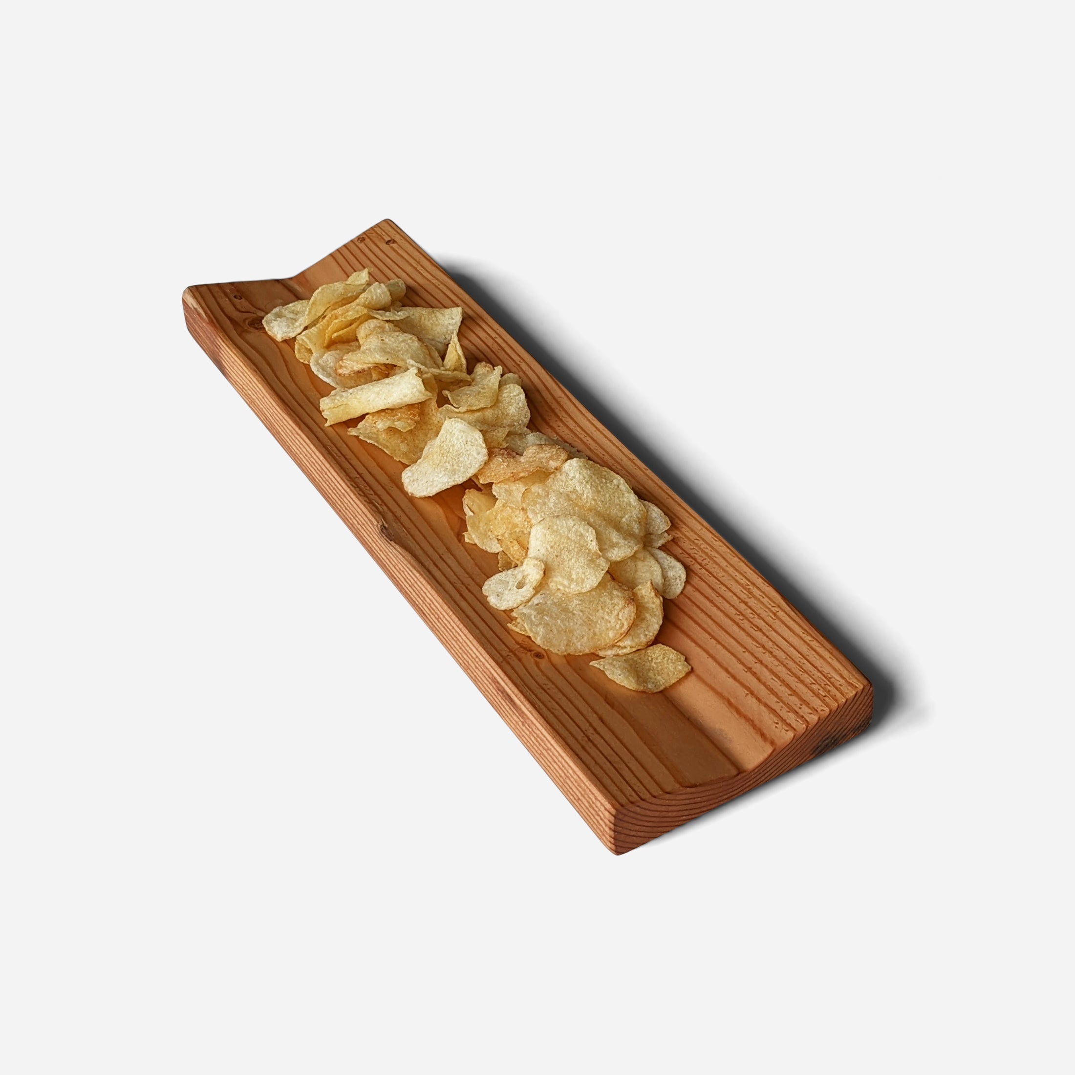 A unique wooden serving tray made from Doug Fir wood, featuring a beeswax finish, perfect for serving snacks during the Super Bowl.