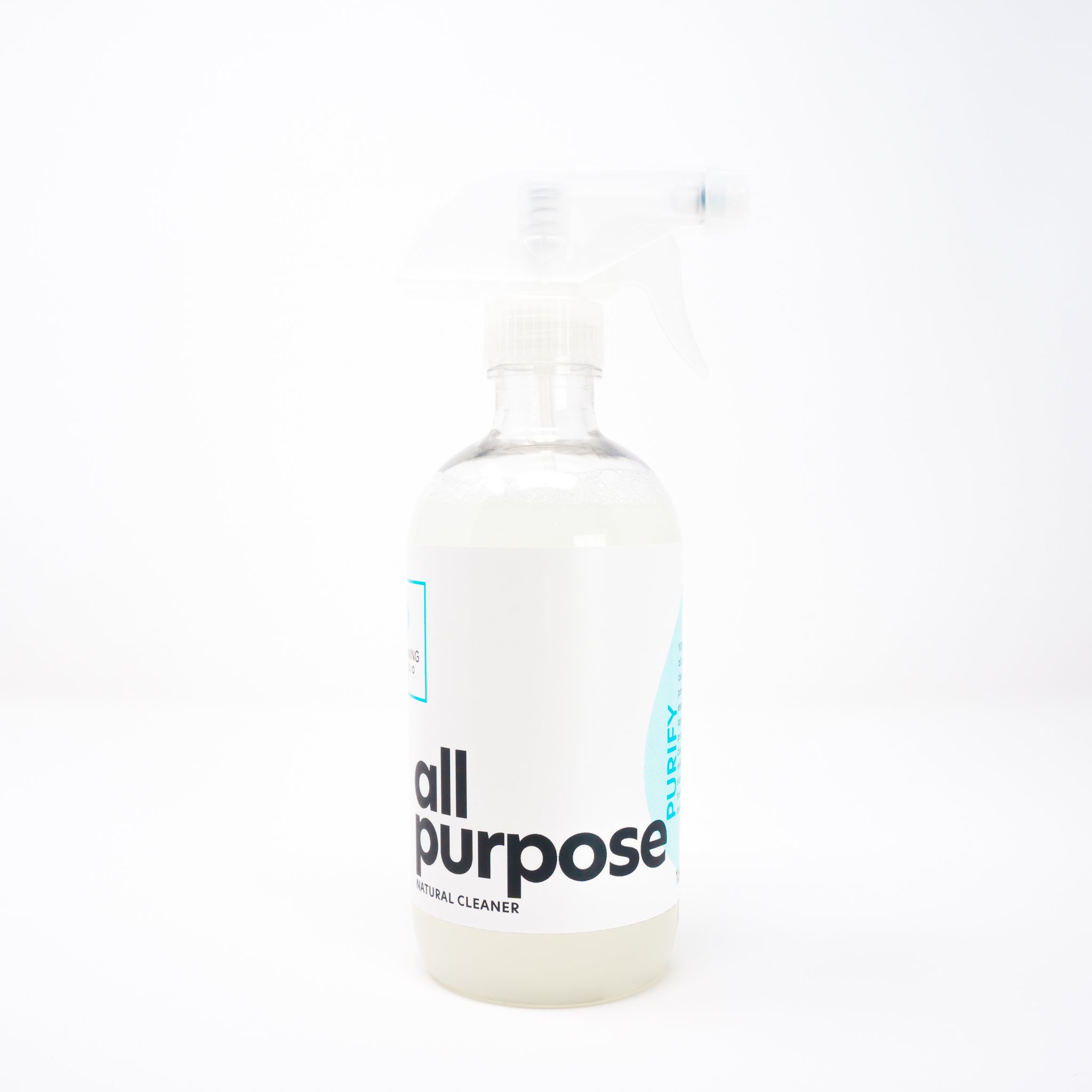 Eco-friendly surface cleaner in a plastic bottle with a spray nozzle, showcasing its natural ingredients and 2oz concentrate.