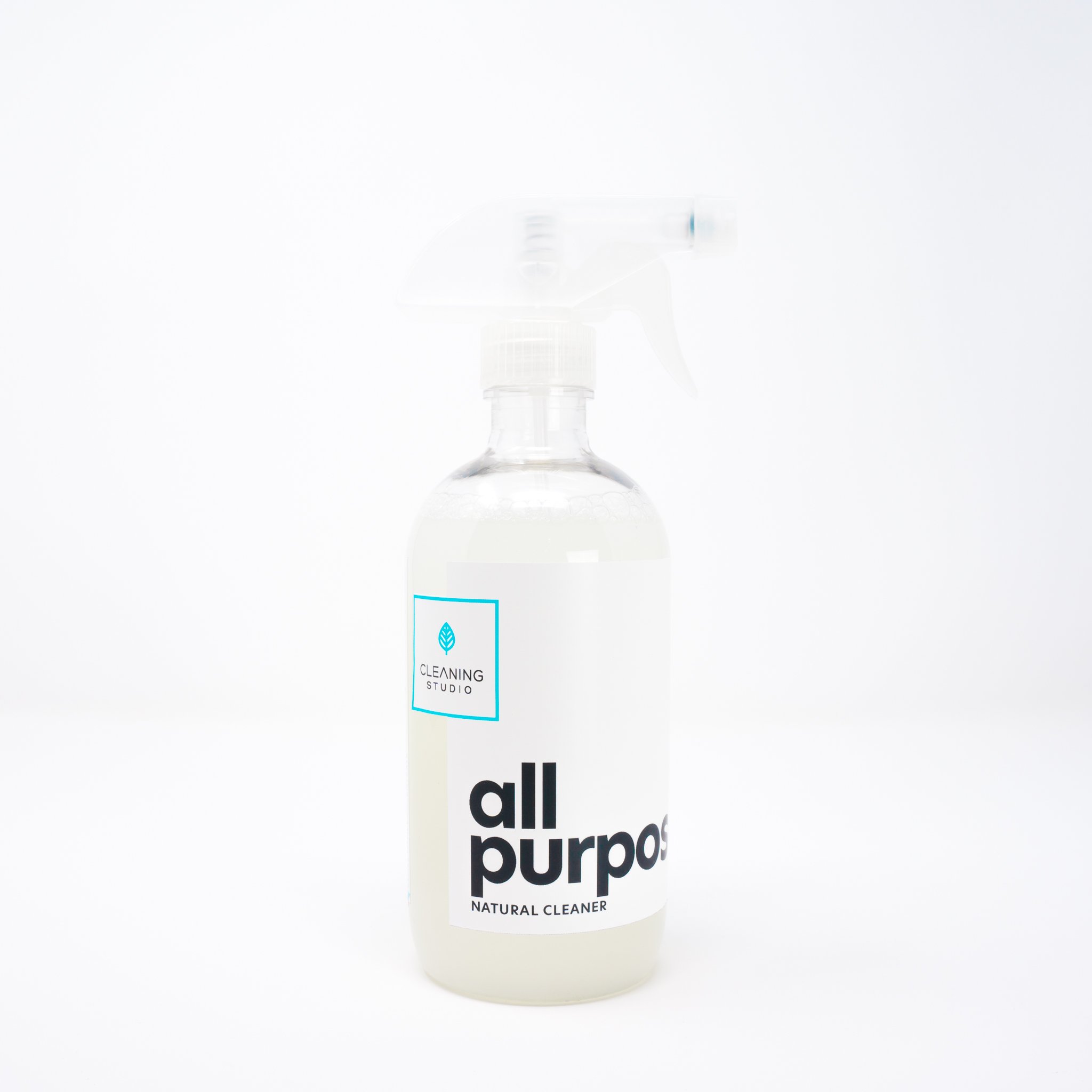 Eco-friendly surface cleaner in a plastic bottle with a spray nozzle, showcasing its natural ingredients and 2oz concentrate.