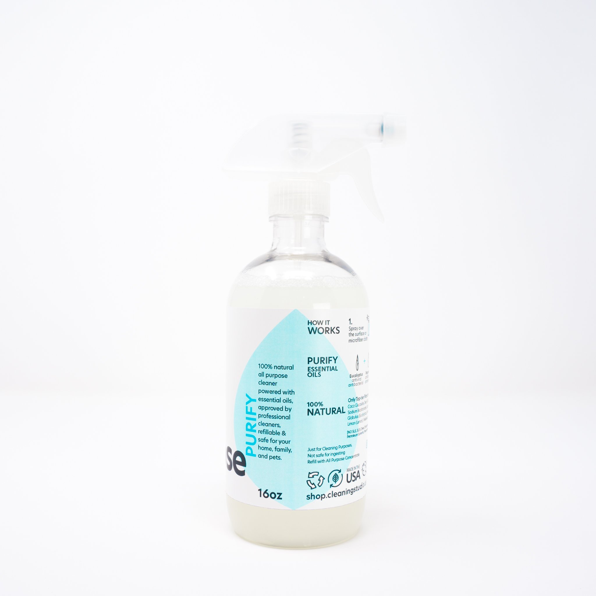 Eco-friendly surface cleaner in a plastic bottle with a spray nozzle, showcasing its natural ingredients and 2oz concentrate.