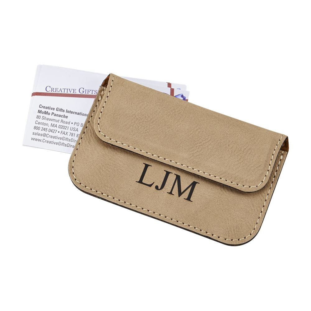 Stylish tan leatherette card case with magnetized flap, holding business cards.