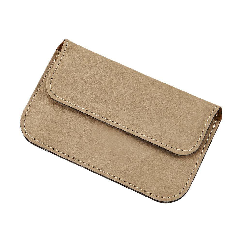 Stylish tan leatherette card case with magnetized flap, holding business cards.