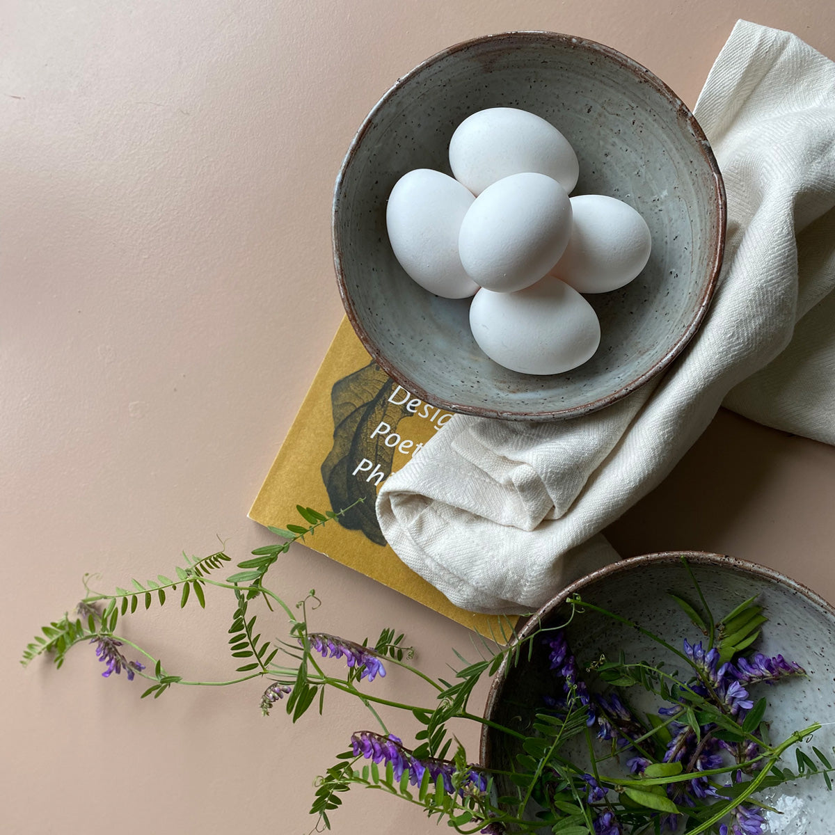 A large TANG ceramic bowl with a unique glaze made from local seaweeds, showcasing its handmade craftsmanship and imperfect design.