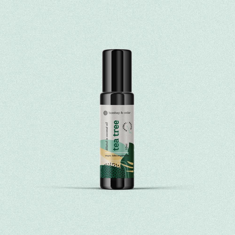 Tea Tree Essential Oil Roll-on in a biophotonic glass bottle with a glass roller ball, designed for soothing skin irritations.