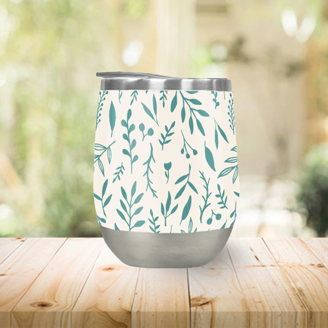 Teal Falling Leaves Wine Tumbler with double-wall insulation and a vibrant design, perfect for outdoor use.