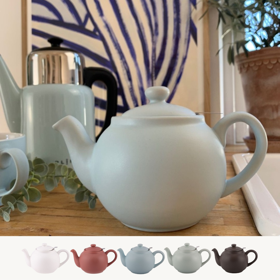 Handmade stoneware teapot with stainless steel strainer, 0.9-liter capacity, featuring unique color and glaze variations.