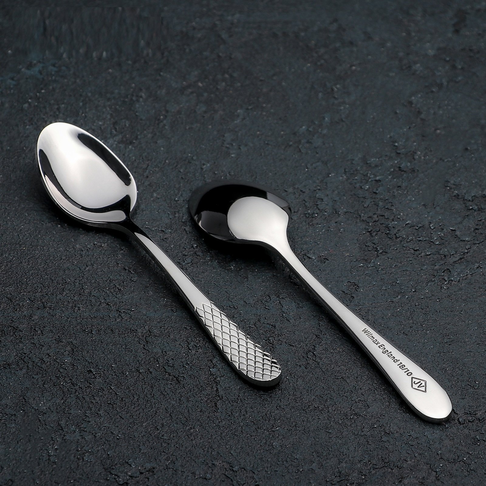 A beautifully arranged set of six 5.5-inch stainless steel teaspoons in an elegant gift box, showcasing their high polish finish.