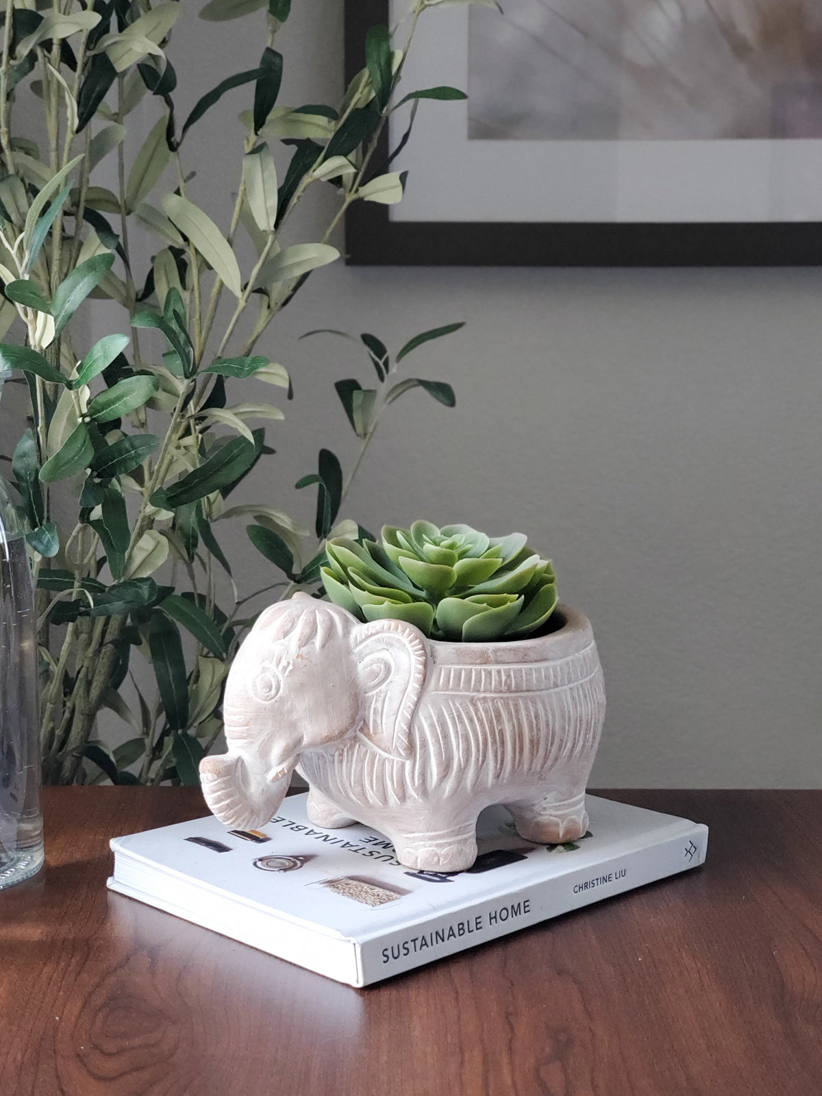 A charming terracotta elephant-shaped pot, perfect for colorful flowers and plants, showcasing its unique design and natural clay finish.