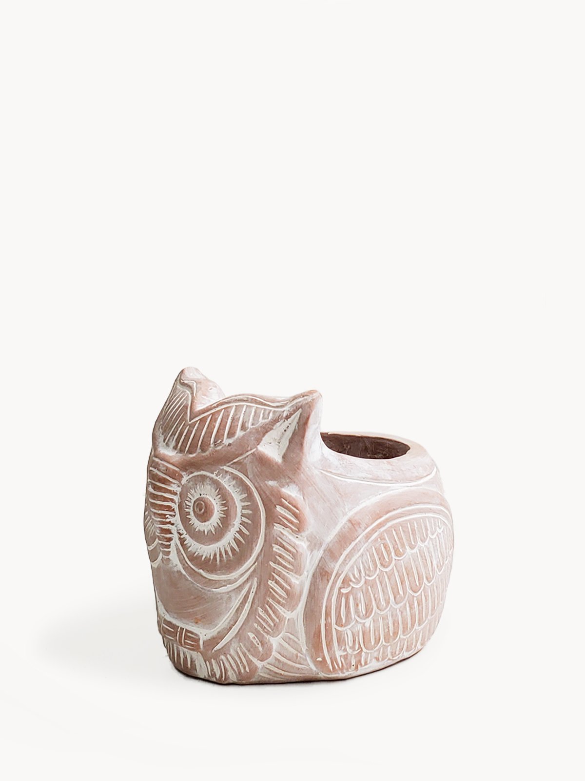 Terracotta pot shaped like a horned owl, perfect for plants and flowers, showcasing unique craftsmanship.