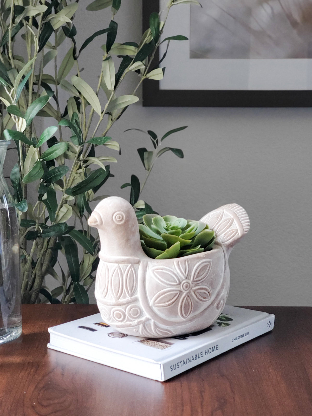 Terracotta pot shaped like a spotted dove, perfect for planting flowers or greenery, showcasing unique craftsmanship.