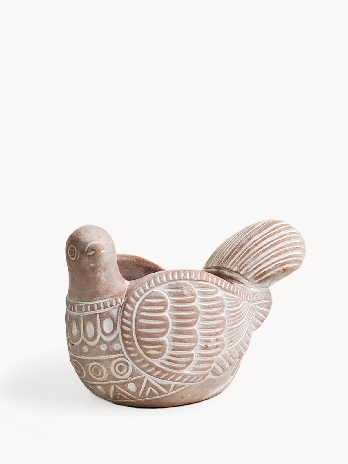 A whimsical terracotta pot shaped like a turtle dove, perfect for colorful flowers and plants, showcasing its natural clay finish.