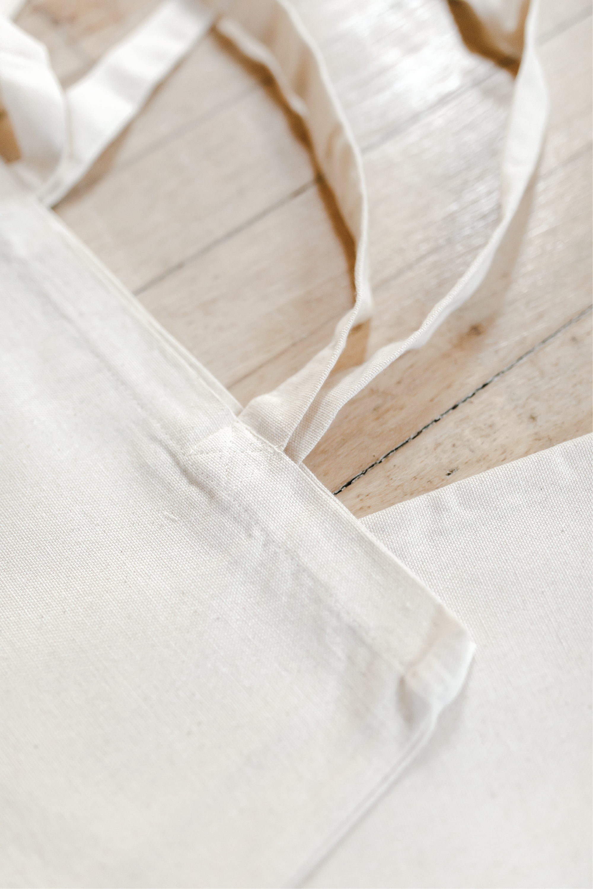 Tetelestai Calligraphy Tote Bag made from organic cotton, featuring elegant calligraphy design, perfect for various uses.