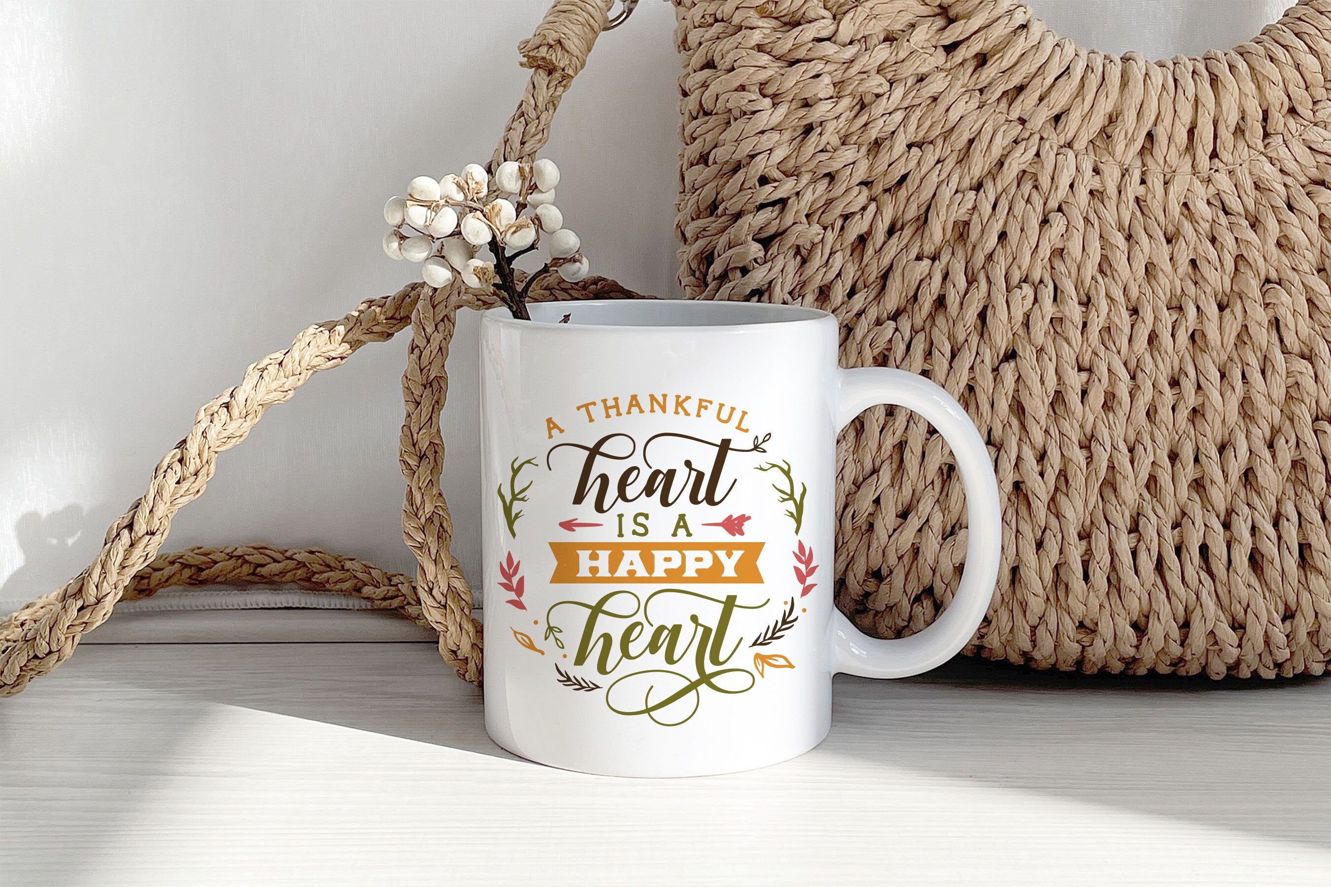 A Thankful Heart is Happy Heart Mug featuring autumn-themed design, perfect for Thanksgiving celebrations.