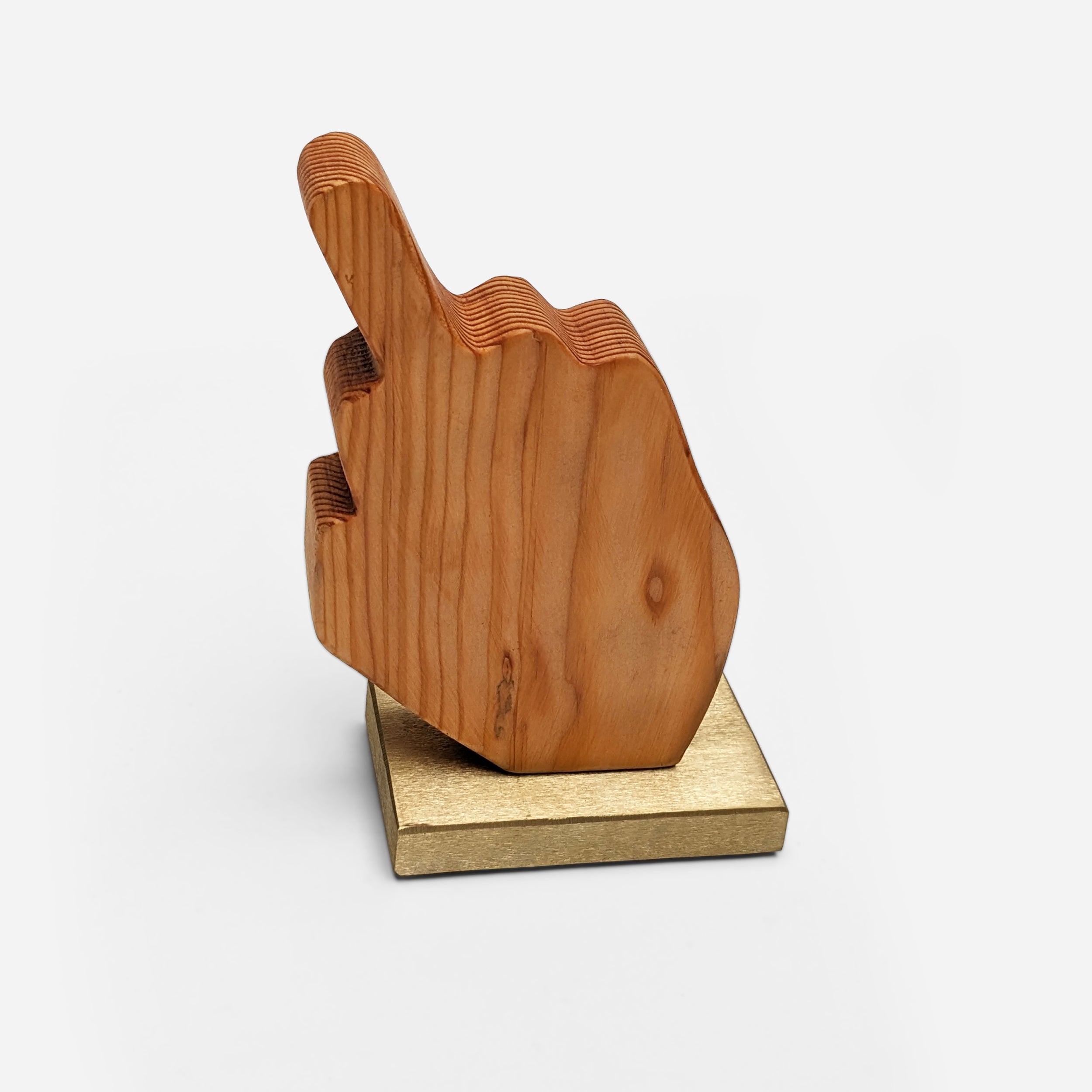 A unique decorative piece called The Finger, made from Doug Fir wood and brass, showcasing its artistic design and craftsmanship.