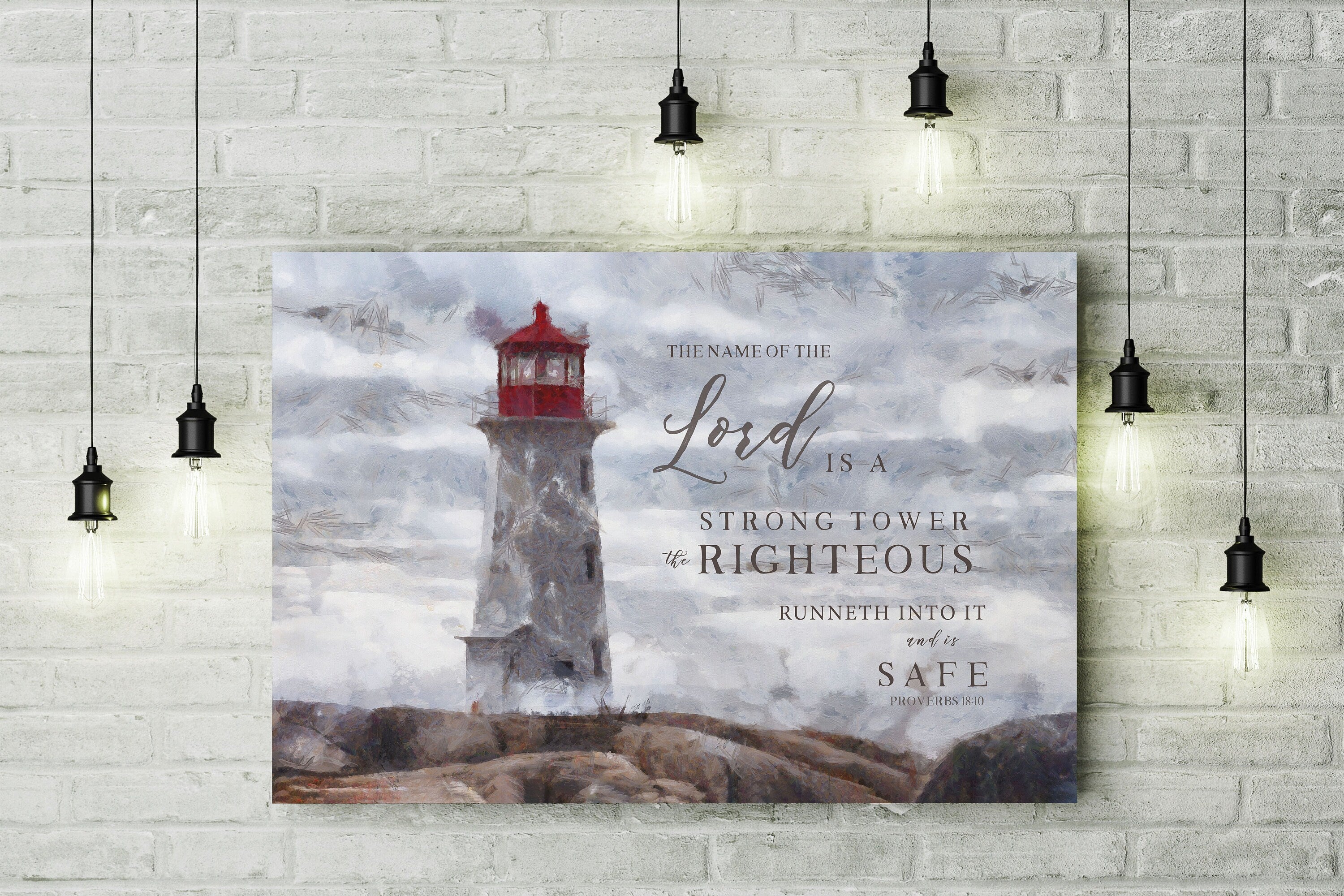 Canvas print featuring a lighthouse and the scripture 'The Name of the Lord is a strong tower' beautifully hand-lettered over a peaceful shore.