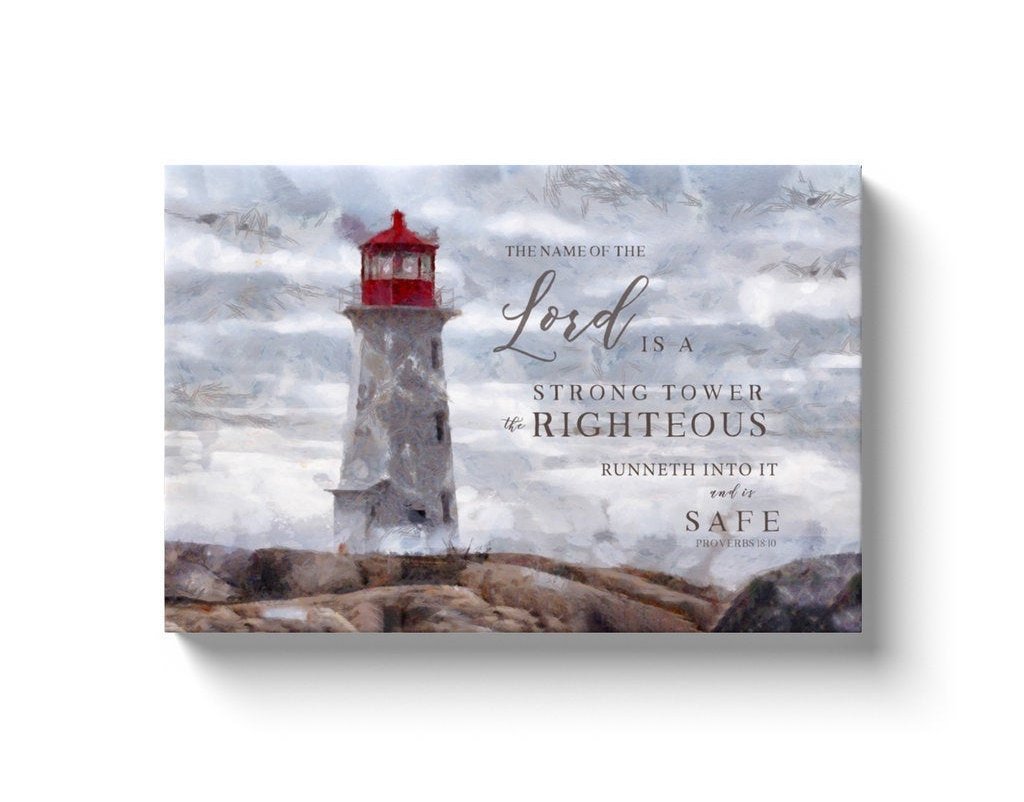 Canvas art featuring a lighthouse with the scripture 'The Name of the Lord is a strong tower' beautifully hand-lettered over a serene shore.