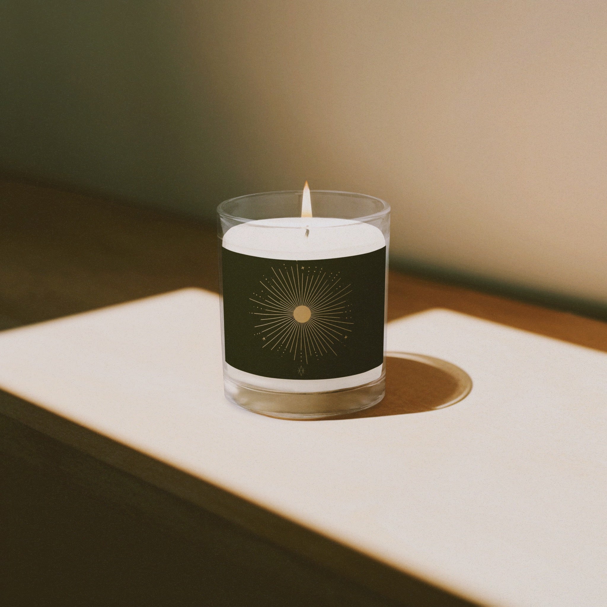 A beautifully crafted glass jar soy wax candle named 'The Sun', designed to provide warmth and comfort during winter.