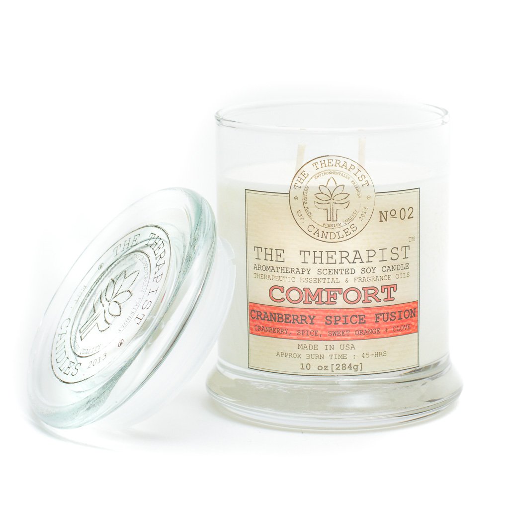 The Therapist Comfort Cranberry Spice Fusion Soy Candle in a thick glass container, showcasing its elegant design and inviting aroma.