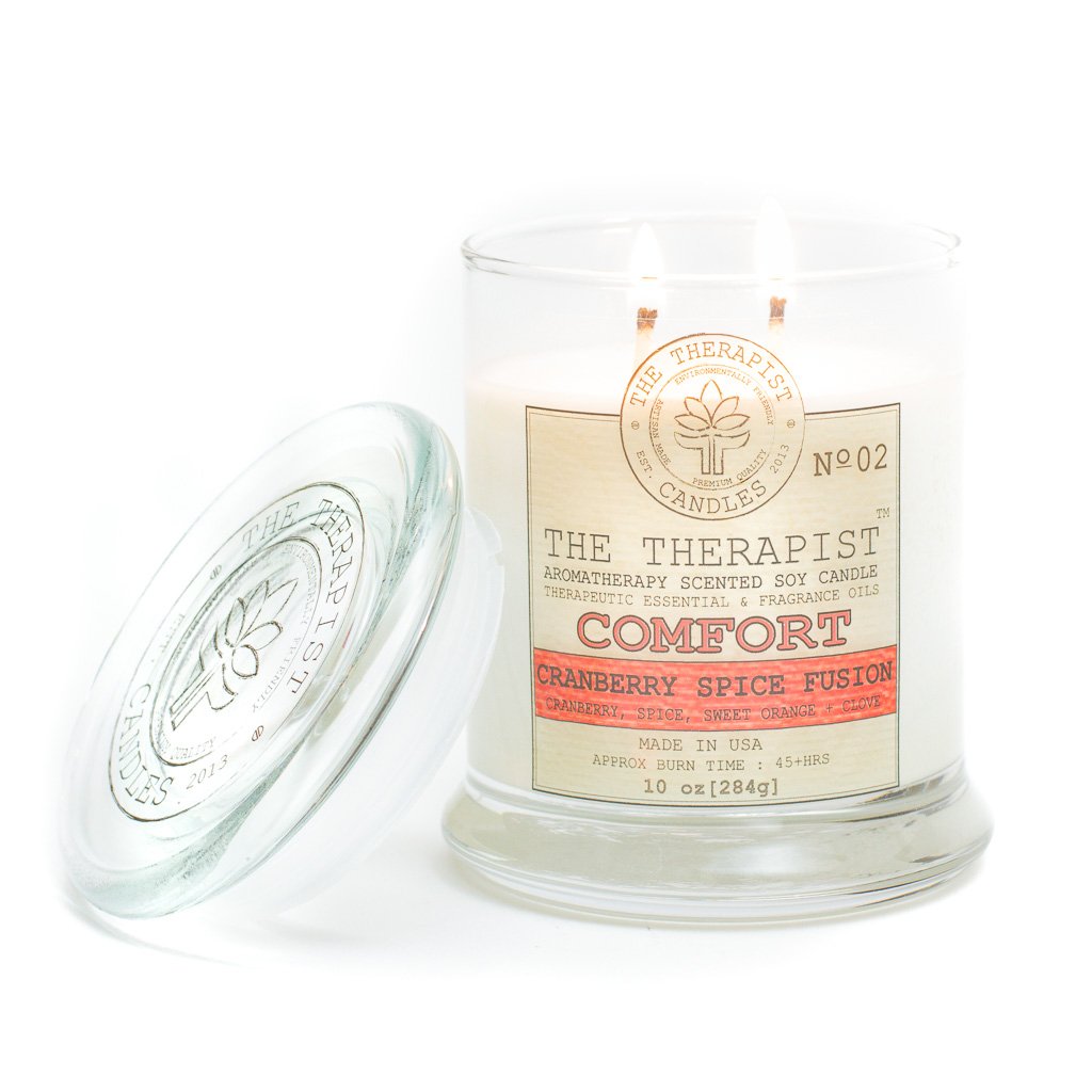 The Therapist Comfort Cranberry Spice Fusion Soy Candle in a thick glass container, showcasing its elegant design and inviting aroma.