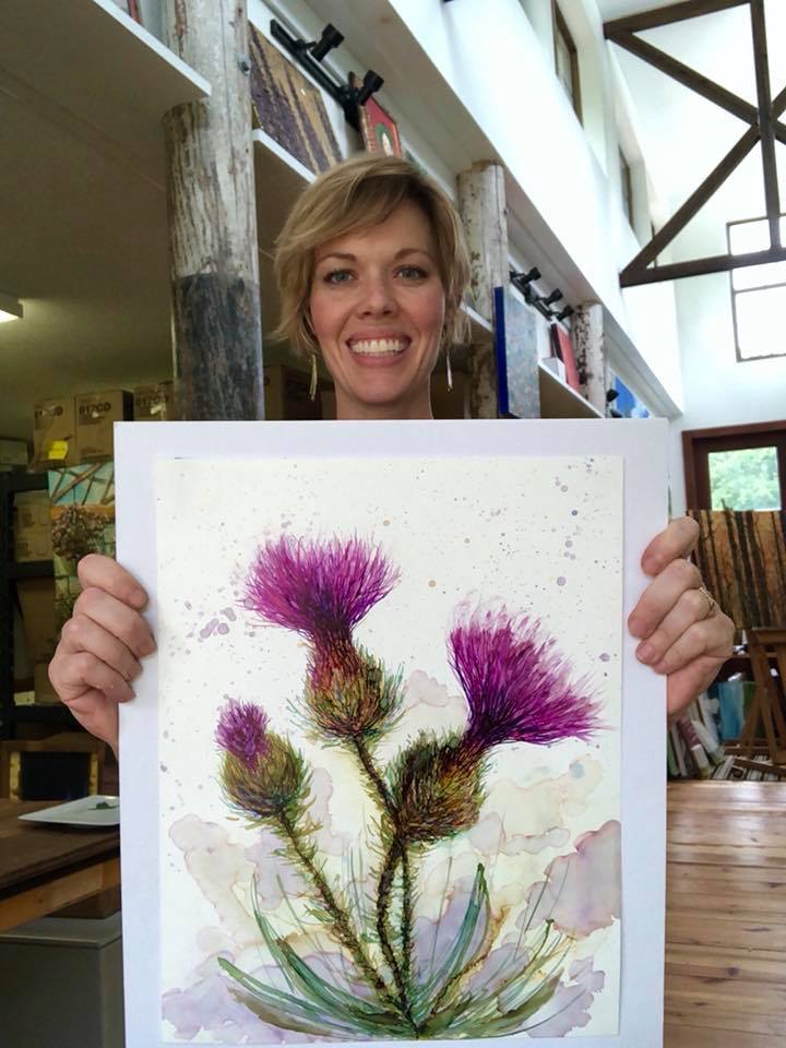 A vibrant painting of three thistles, showcasing intricate details and soothing colors, created with alcohol inks.