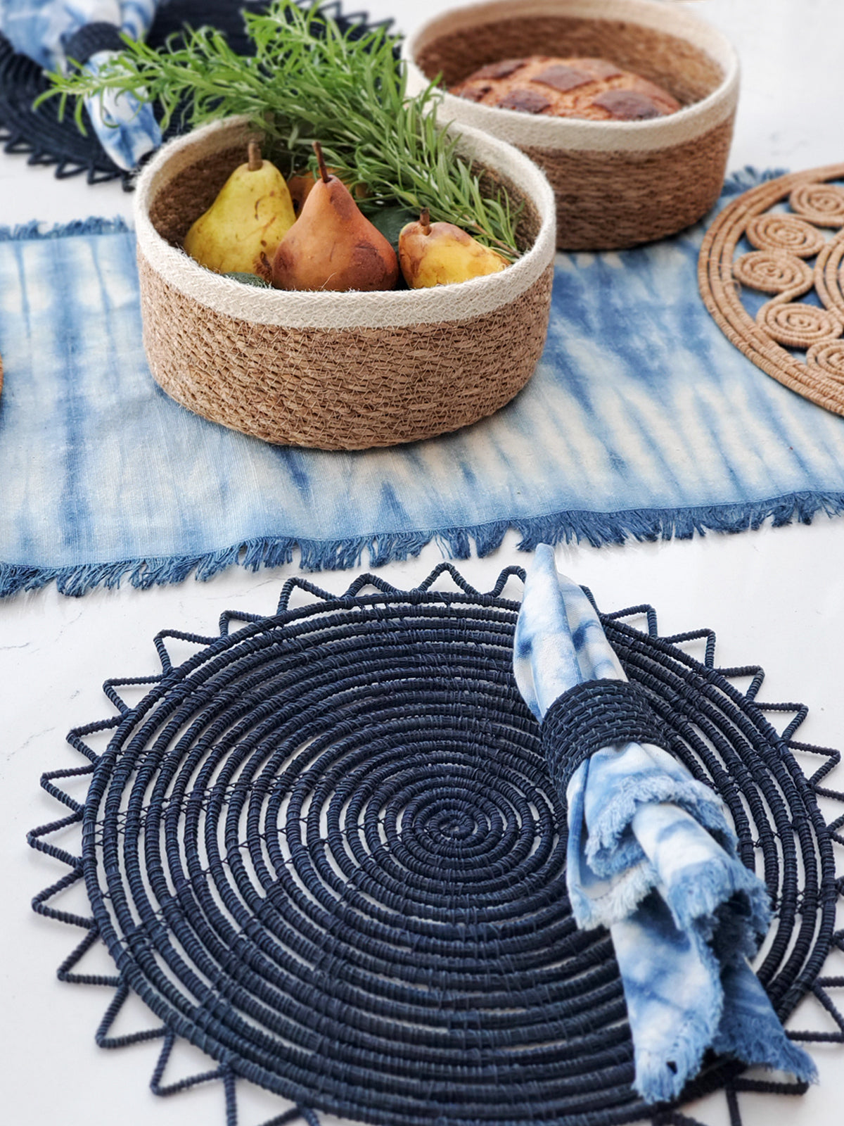 Set of four Indigo Blue Tie Dye Cotton Napkins, showcasing unique patterns and vibrant colors, perfect for enhancing table settings.