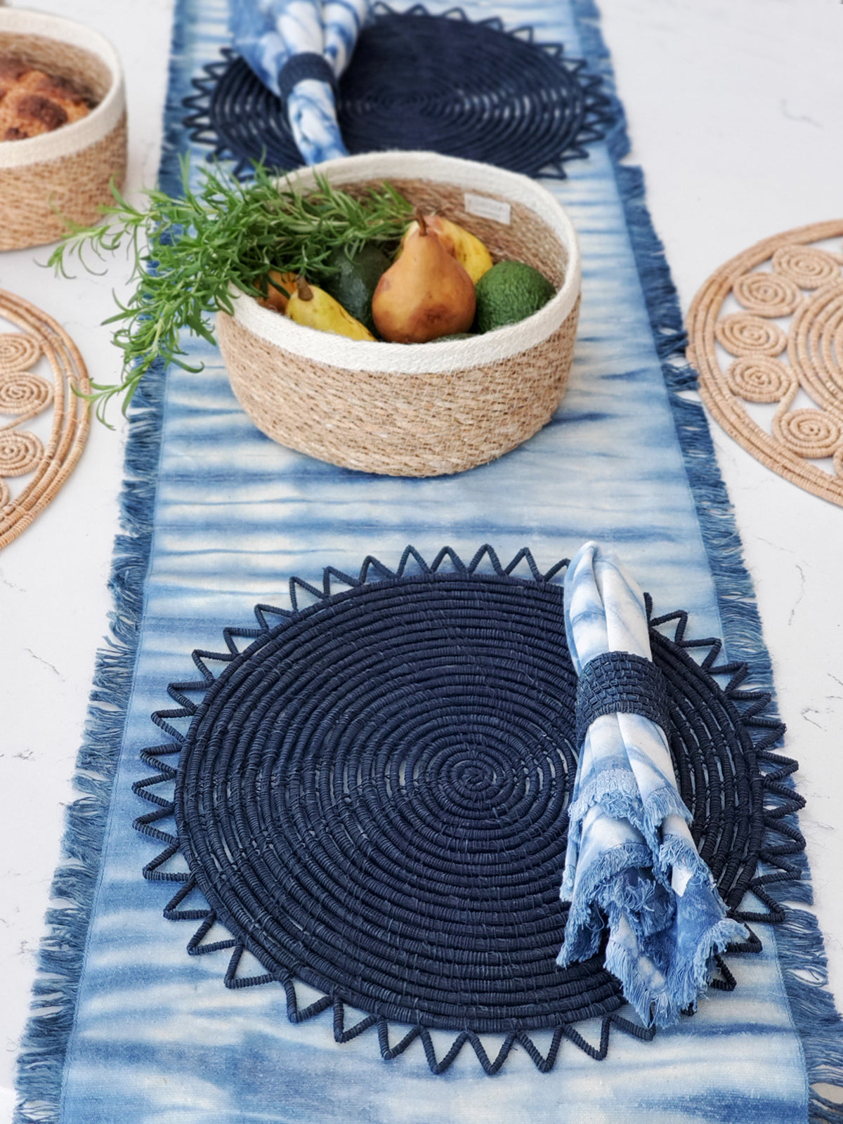 Set of four Indigo Blue Tie Dye Cotton Napkins, showcasing unique patterns and vibrant colors, perfect for enhancing table settings.