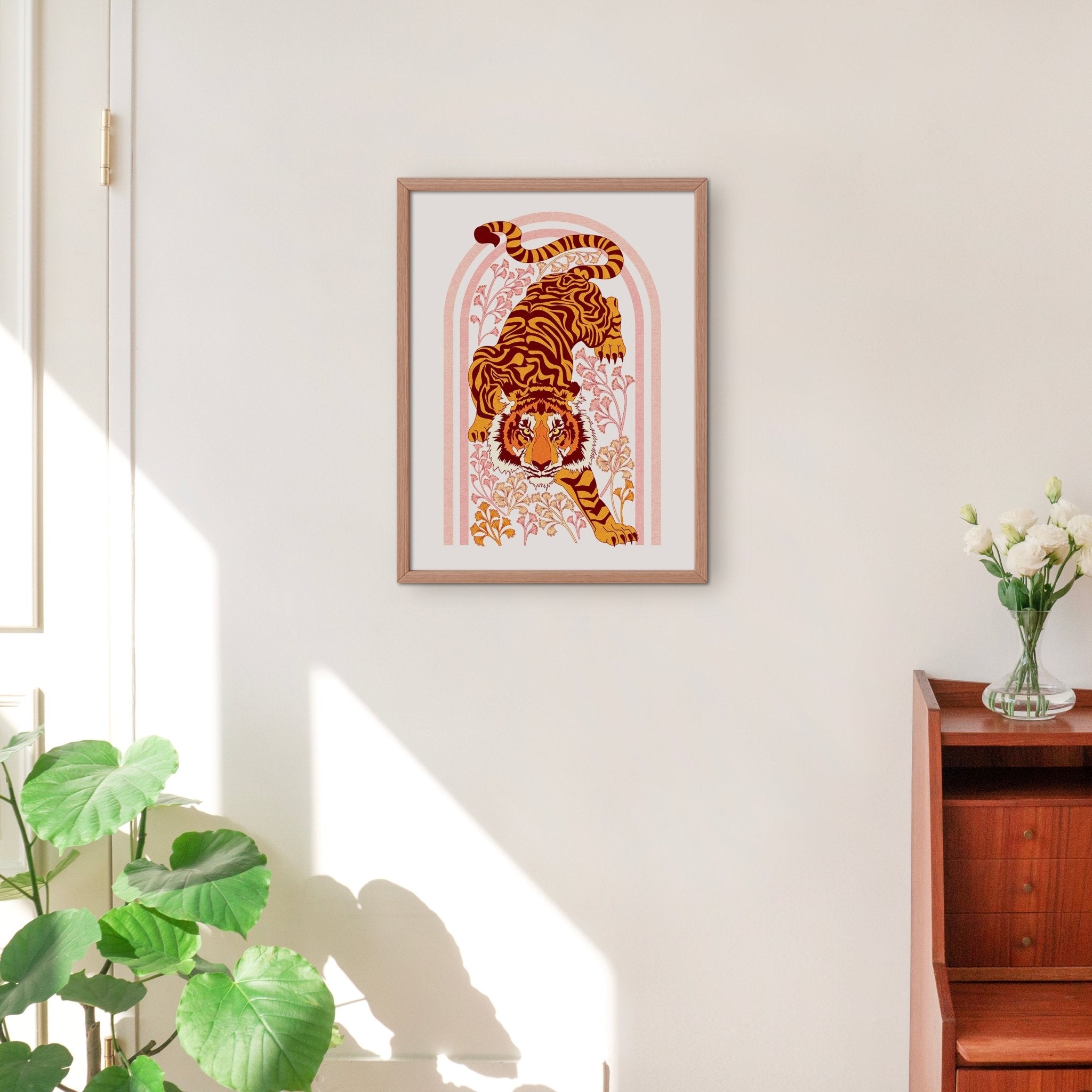 Tiger Tiger Art Print featuring a tiger illustration with botanical motifs in an orange arch shape.