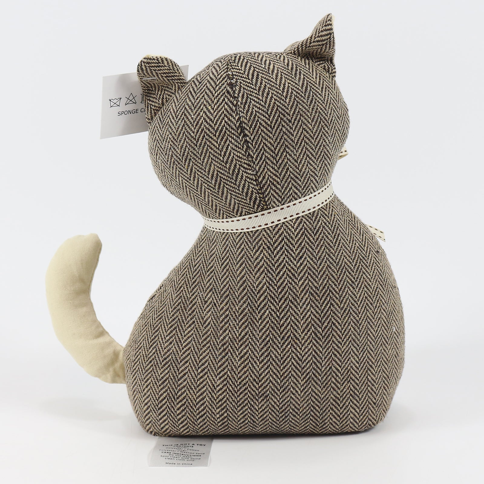 Tilly The Cat Soft Weighted Fabric Door Stop, a charming cat-shaped door stop made of soft polyester, designed to hold doors open securely.