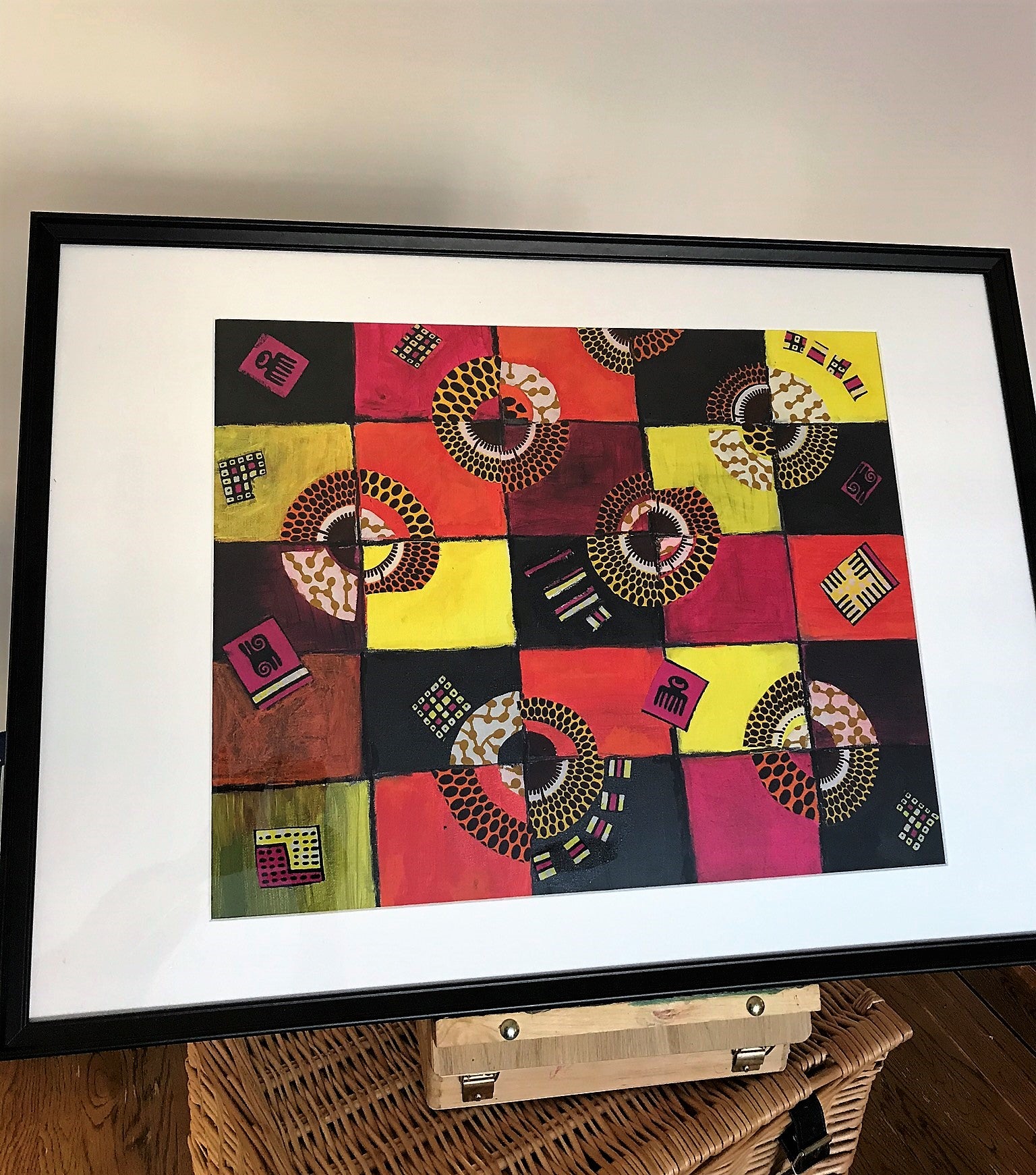 TIMELESS Recycled Ankara Fabric Art featuring vibrant colors and ancient African symbols on a canvas panel.