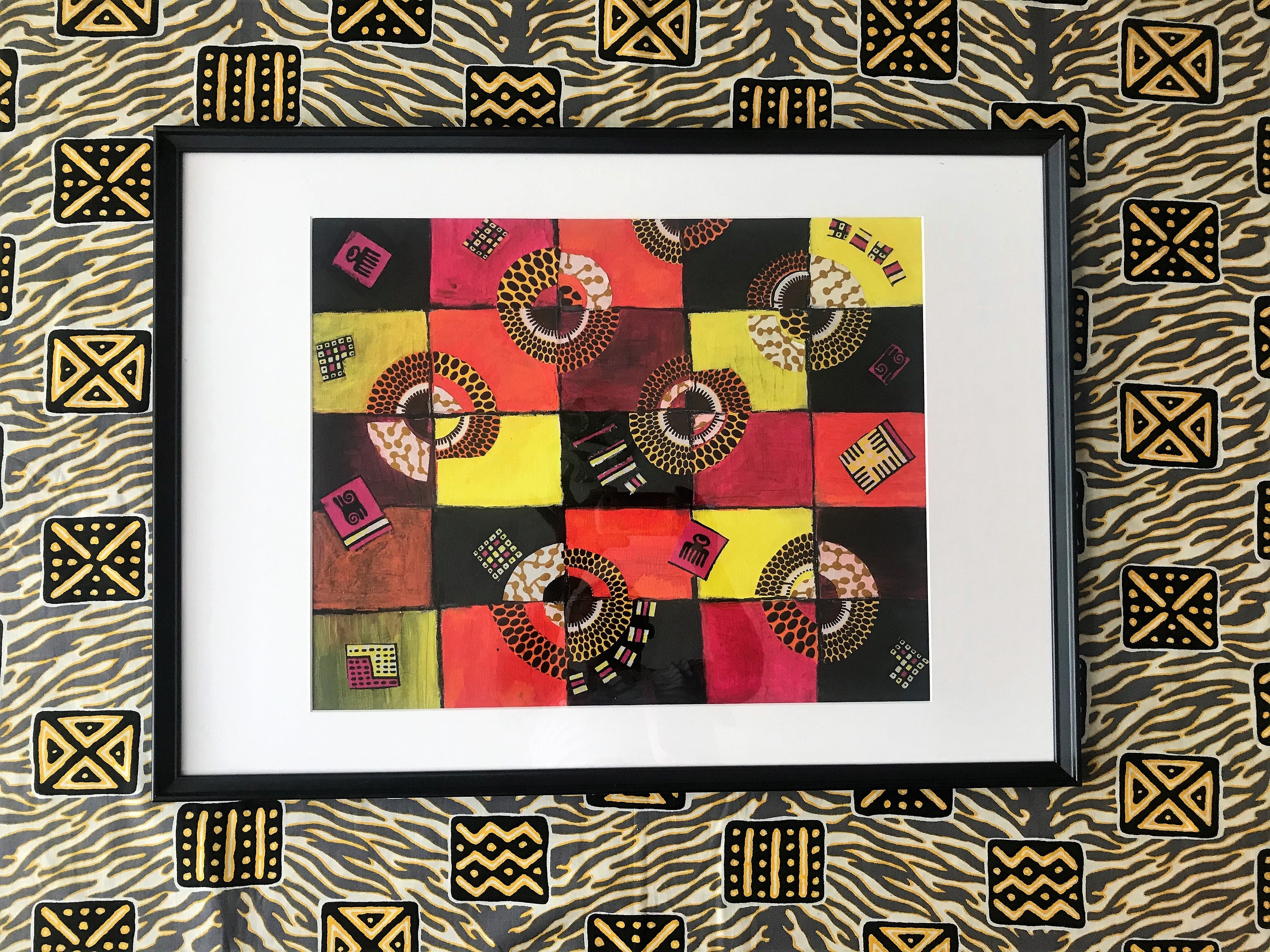 TIMELESS Recycled Ankara Fabric Art featuring vibrant colors and ancient African symbols on a canvas panel.