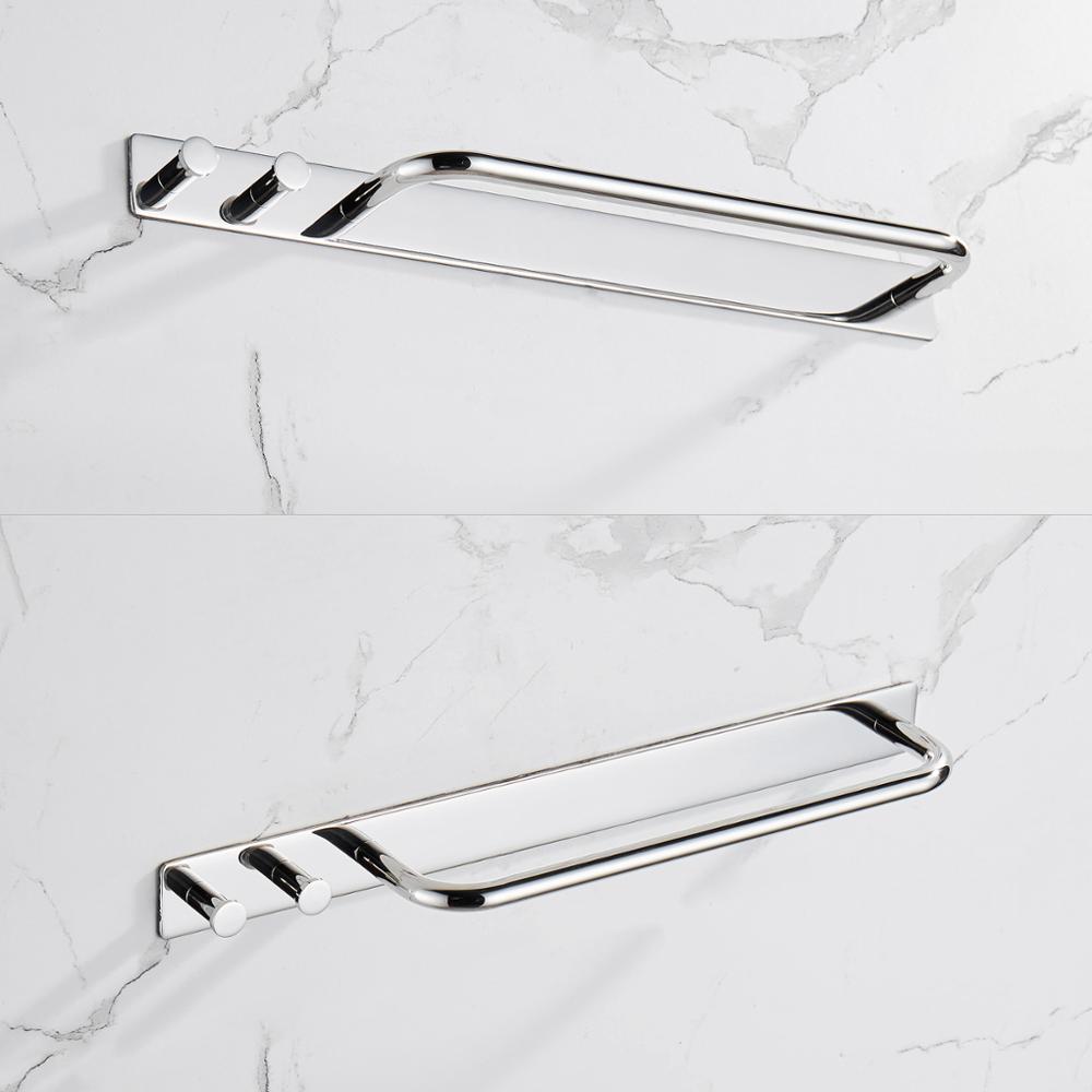 A sleek towel bar holder rack made of polished 304 stainless steel, featuring a strong adhesive backing for easy installation, ideal for hanging towels and robes.