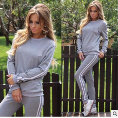 A stylish two-piece tracksuit for women featuring a geometric print, made from soft polyester, perfect for winter activities.