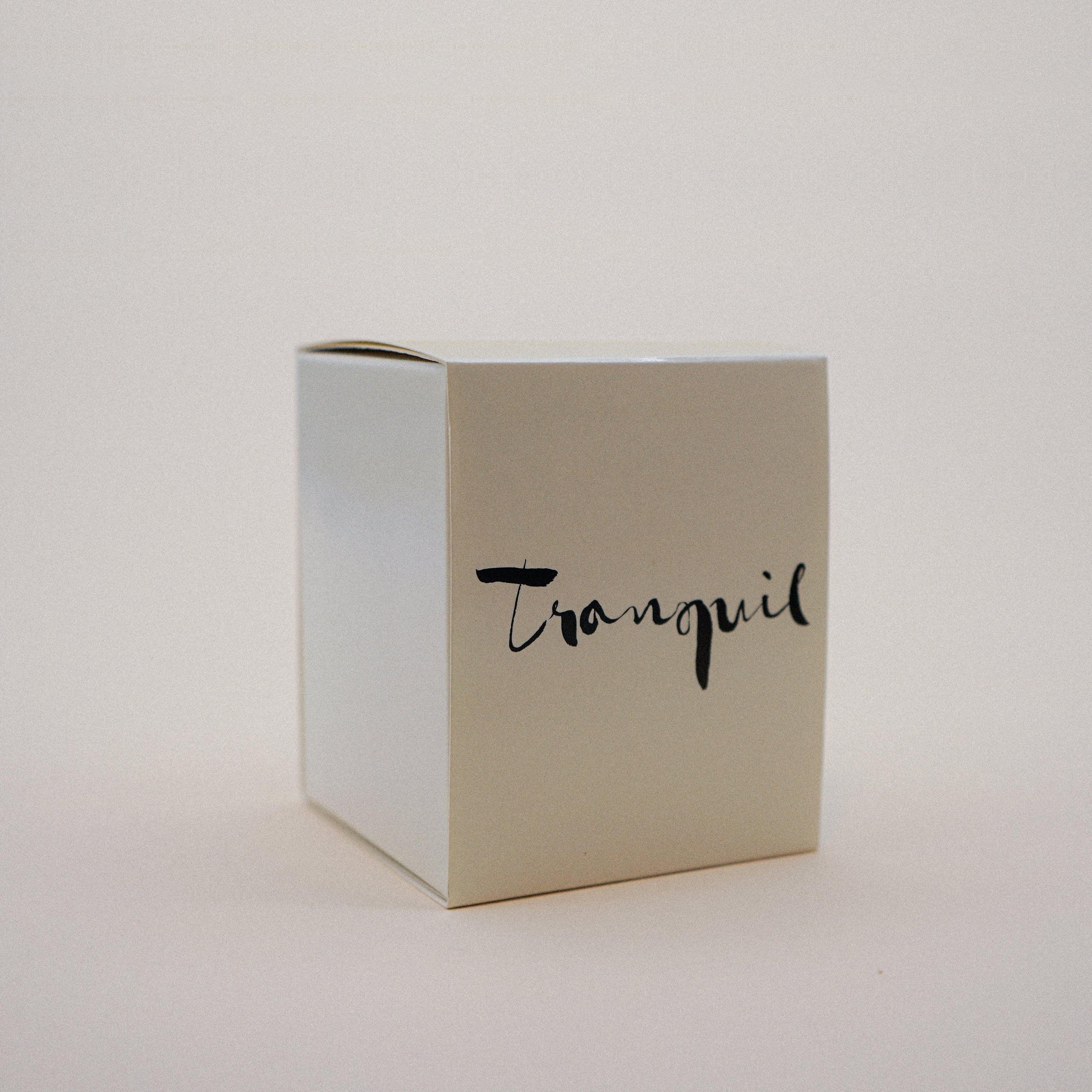 Tranquil Natural Wax Candle in white glass with brush painting design, featuring lavender and bergamot essential oils.