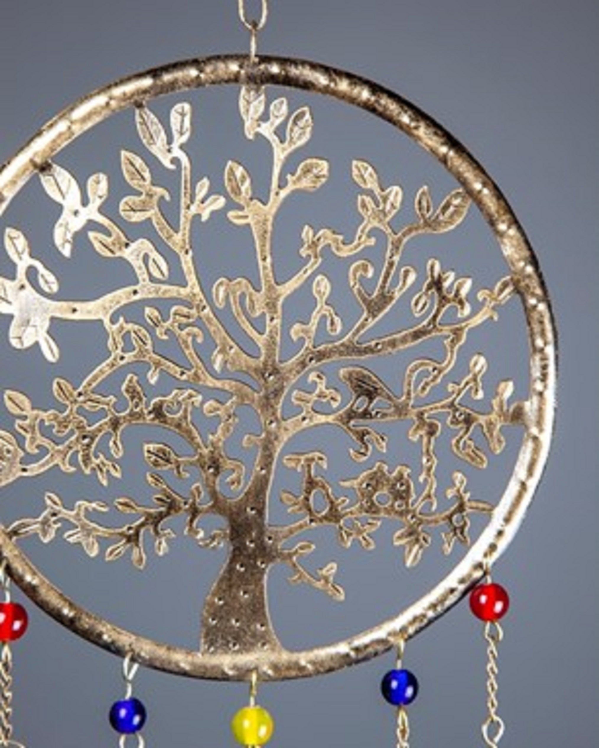 Handmade Tree of Life chime featuring brass bells, colorful glass beads, and intricate metal design, perfect for home decor.