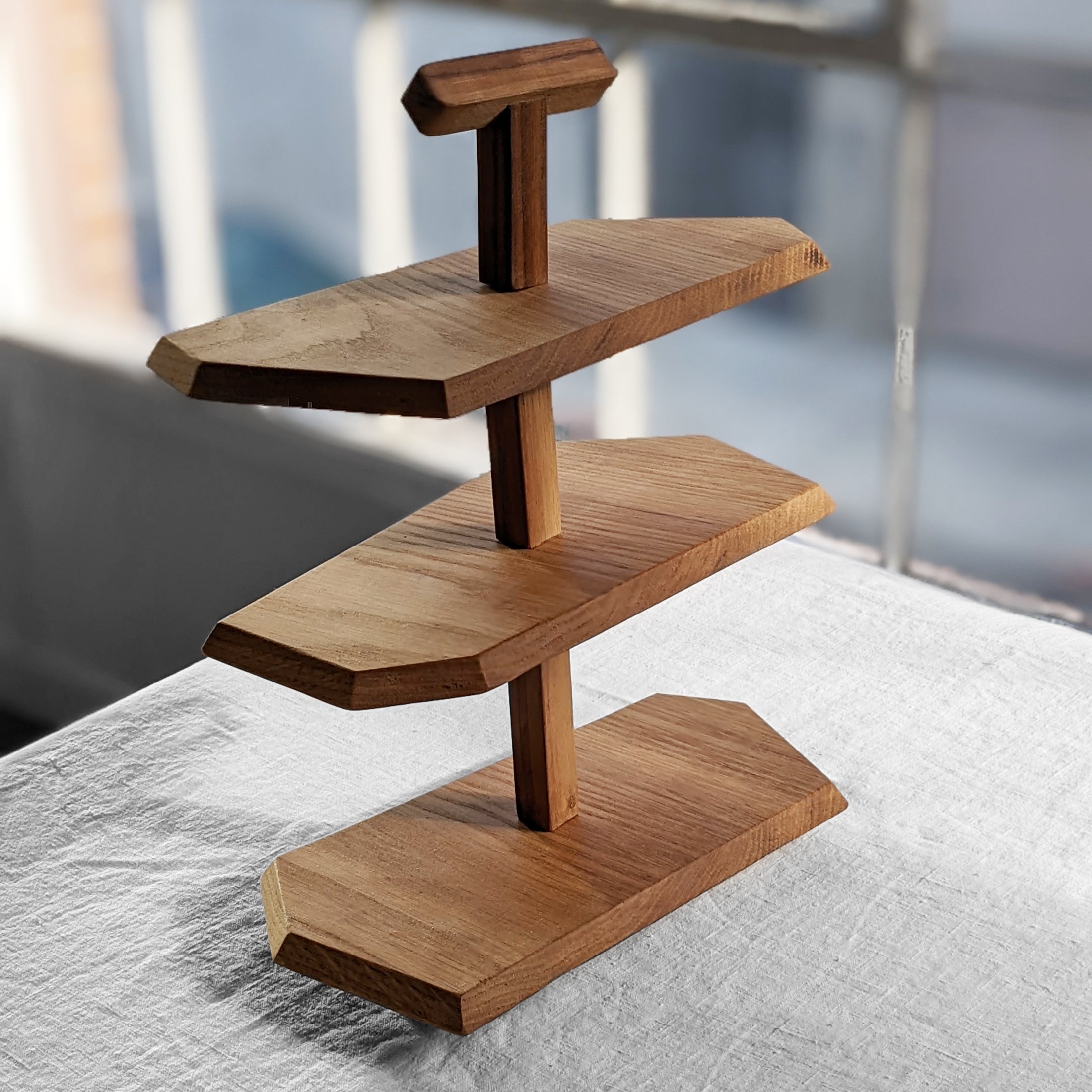 Triple Decker Stand made from Doug Fir wood with a beeswax finish, showcasing three unique levels for display.