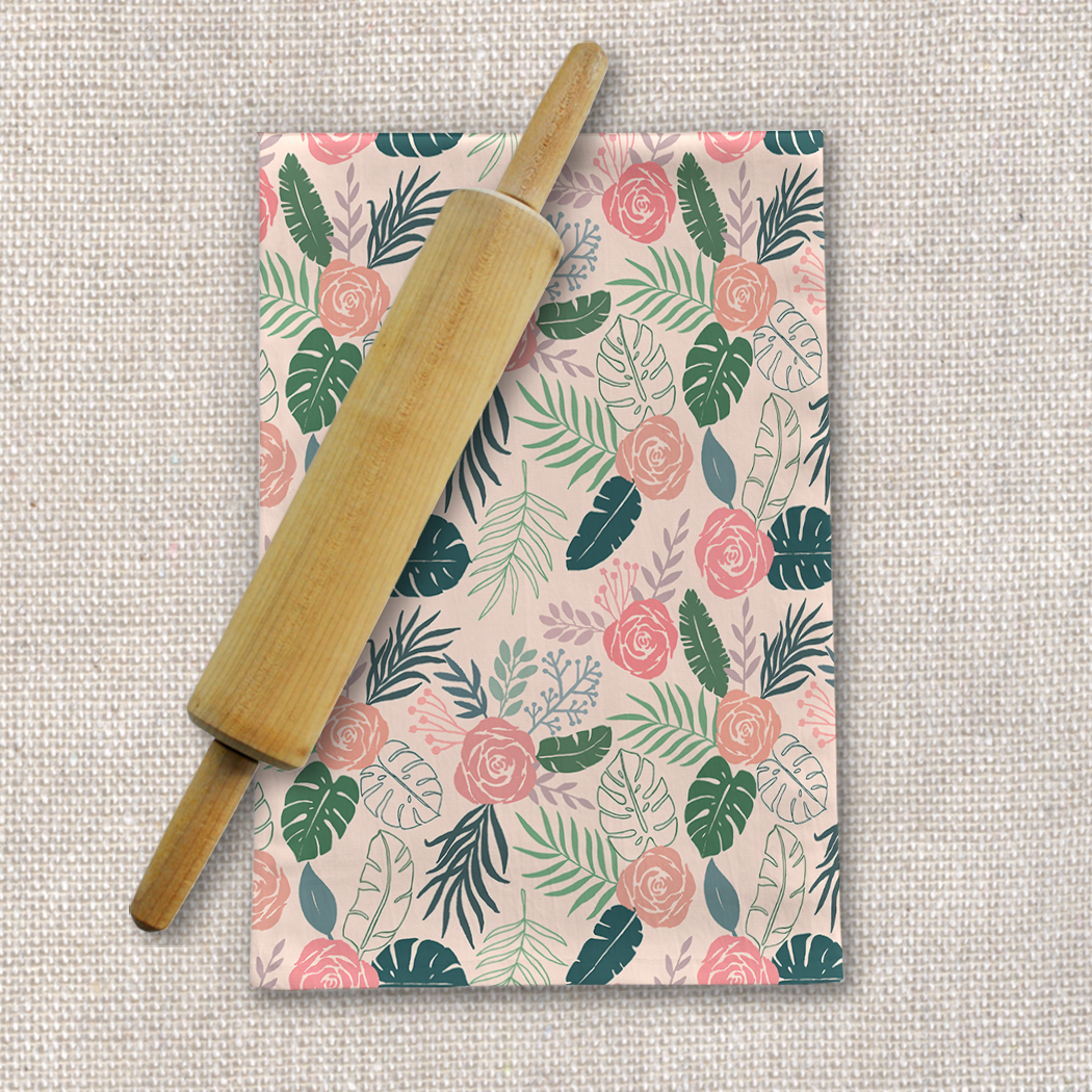 A vibrant Tropical Floral Tea Towel featuring a colorful floral design on a cotton twill fabric, perfect for kitchen use.