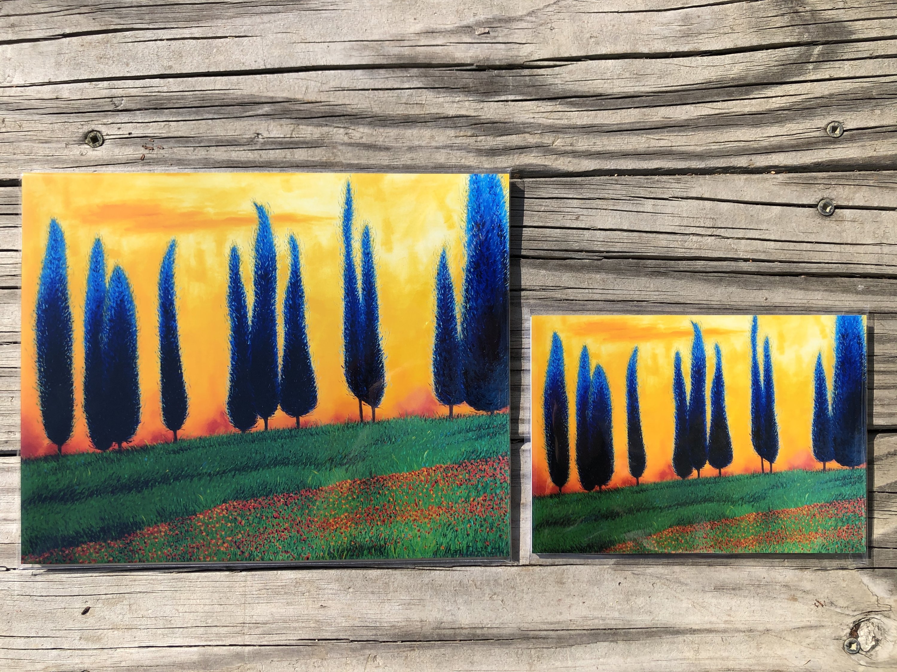 A beautiful glossy print of a Tuscan landscape featuring rolling hills and vibrant colors, perfect for home decor.