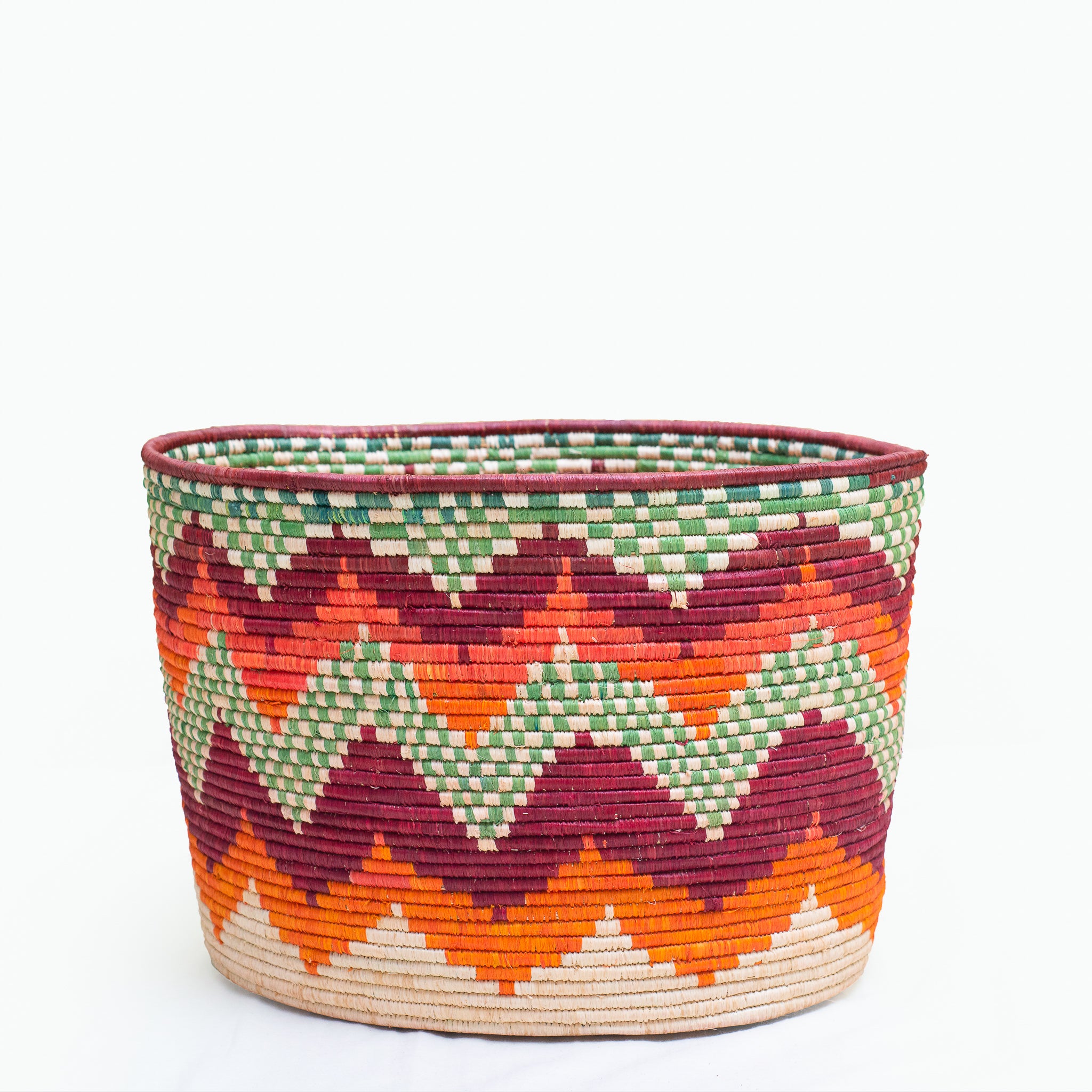 Colorful woven basket with zigzag pattern.