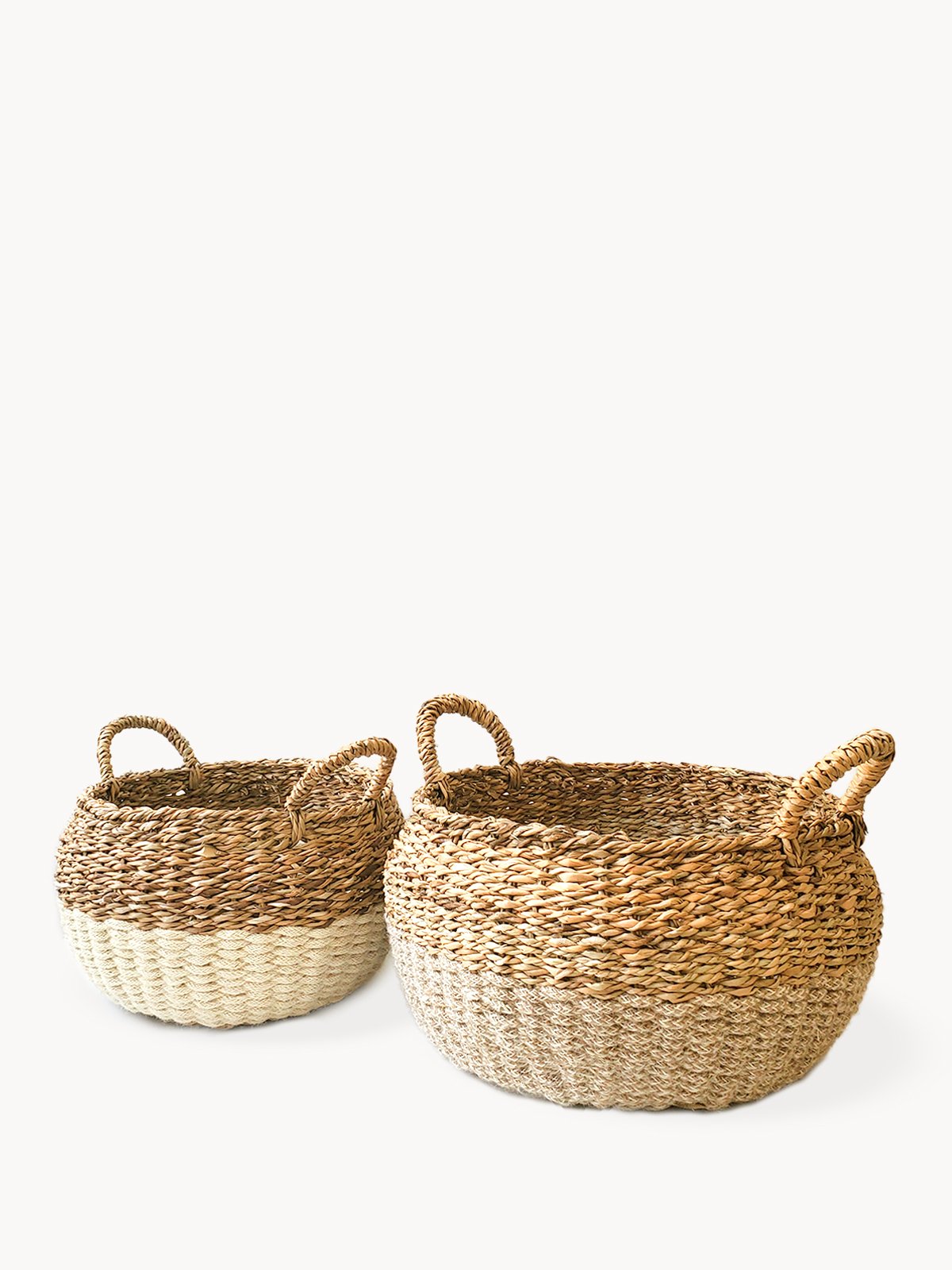 Ula Floor Basket in natural color, made from seagrass and jute, showcasing its stylish and multifunctional design.