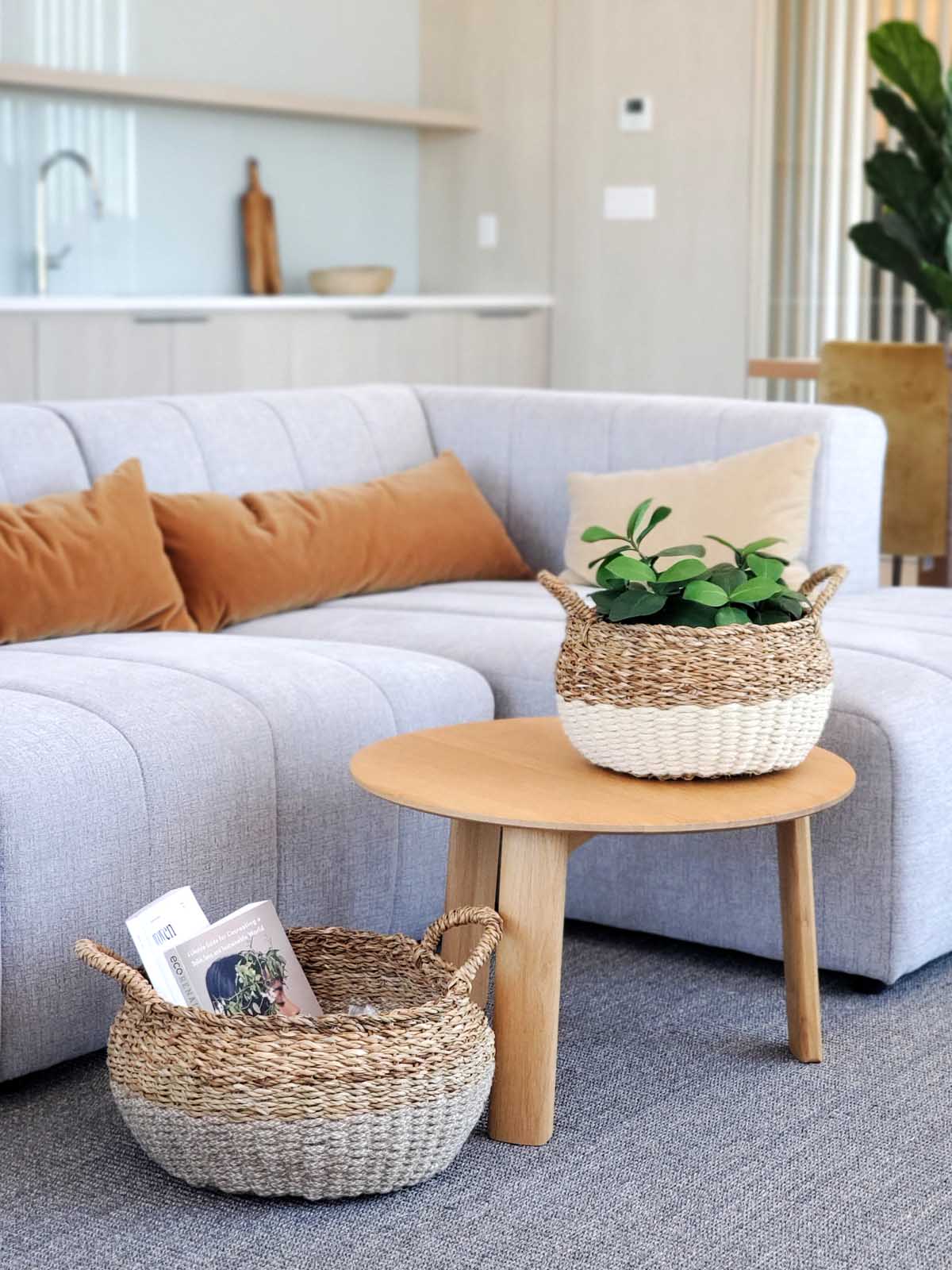 Ula Floor Basket in natural color, made from seagrass and jute, showcasing its stylish and multifunctional design.